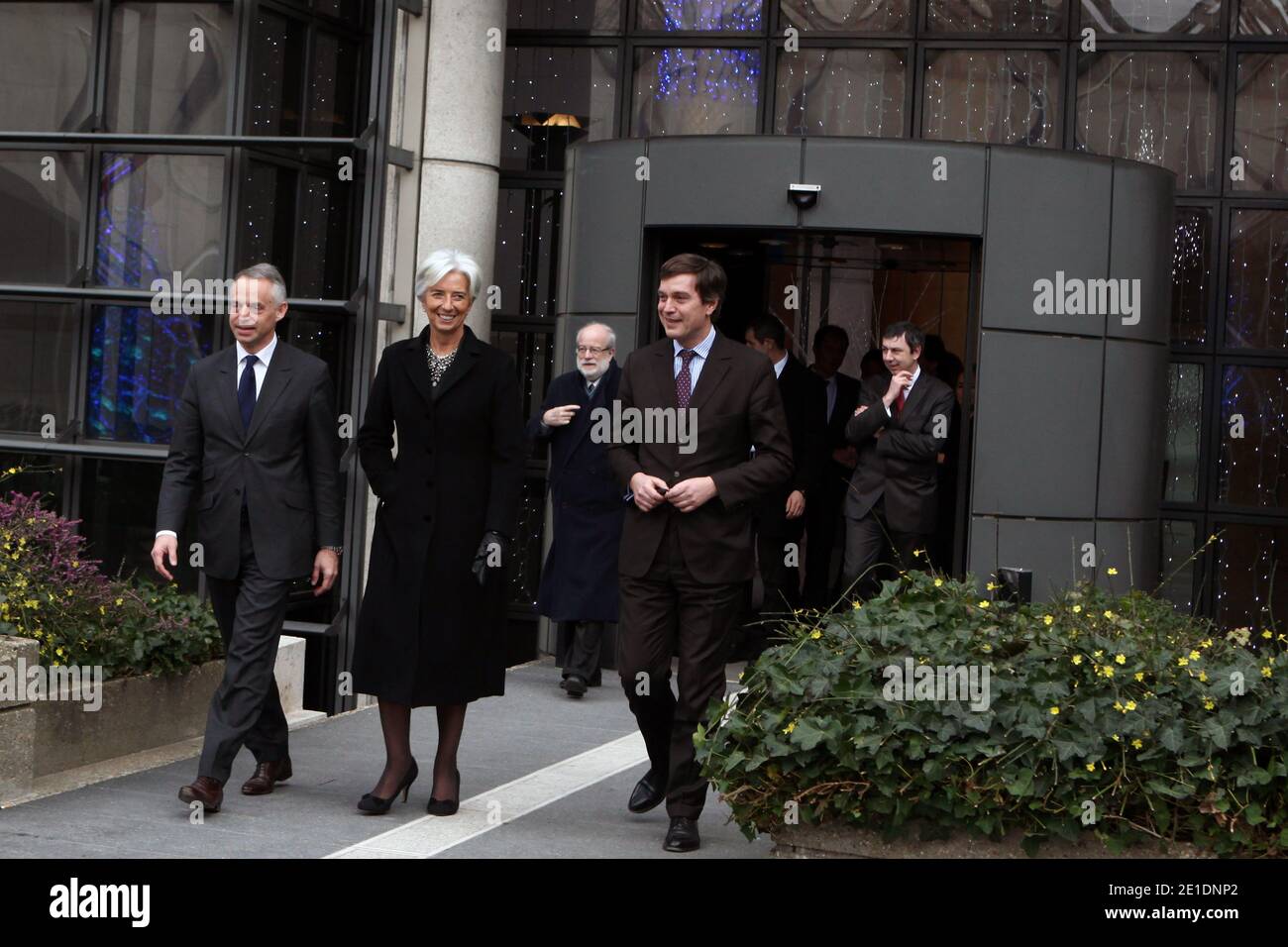 French Minister for the Economy, Finance and Industry Christine Lagarde flanked Peugeot Managing Director Vincent Rambaud arrives for drive an Ion Peugeot full electric, in Paris, France, on January 20, 2011. The Economy ministry will use the four seat four-door city ion car, launched at the end of 2010. Photo by Stephane Lemouton/ABACAPRESS.COM Stock Photo