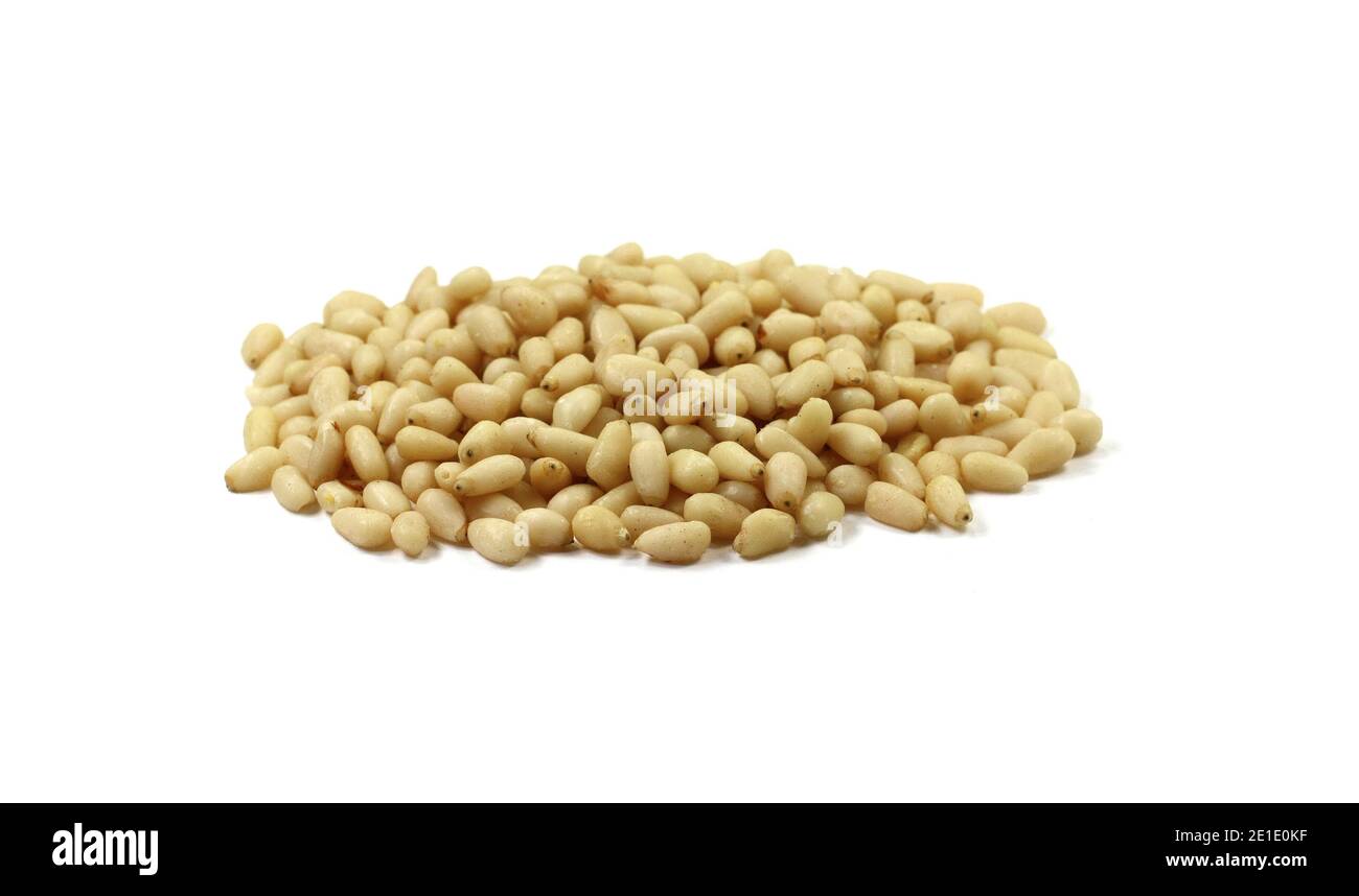 peeled pine nuts isolated on a white background Stock Photo