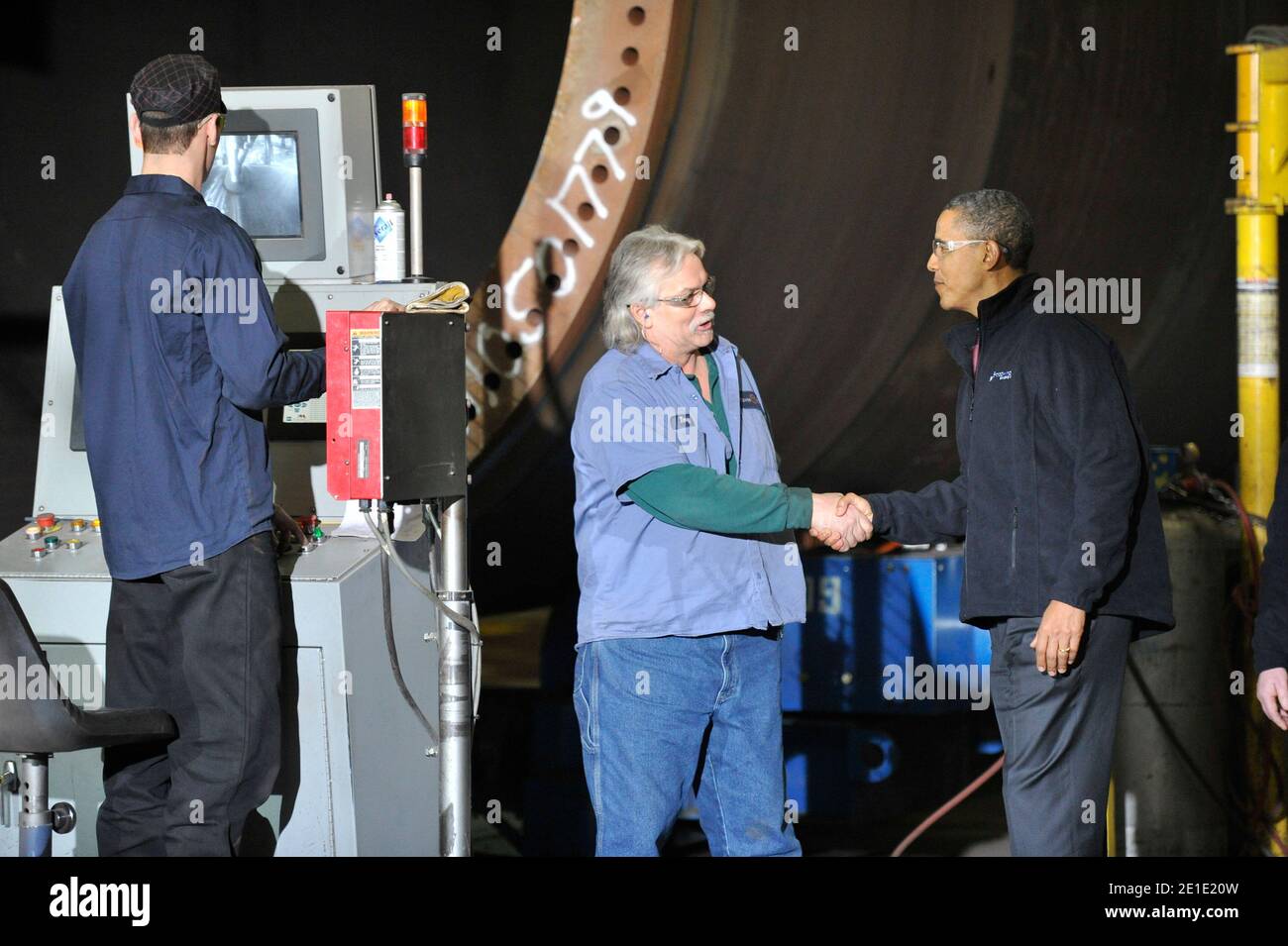 U. S. President Barack Obama (R) greets workers as he tours Tower Tech Systems, Inc., a manufacturer of utility-scale wind towers and monopiles for on- and off-shore wind development, in Manitowoc, Wisconsin on January 26, 2011. President Obama, Vice President Joe Biden and other members of the President's Cabinet traveled across the country Wednesday to highlight the administration's efforts to rebuild the American economy. Photo by Brian Kersey/UPI/ABACAUSA.COM Stock Photo