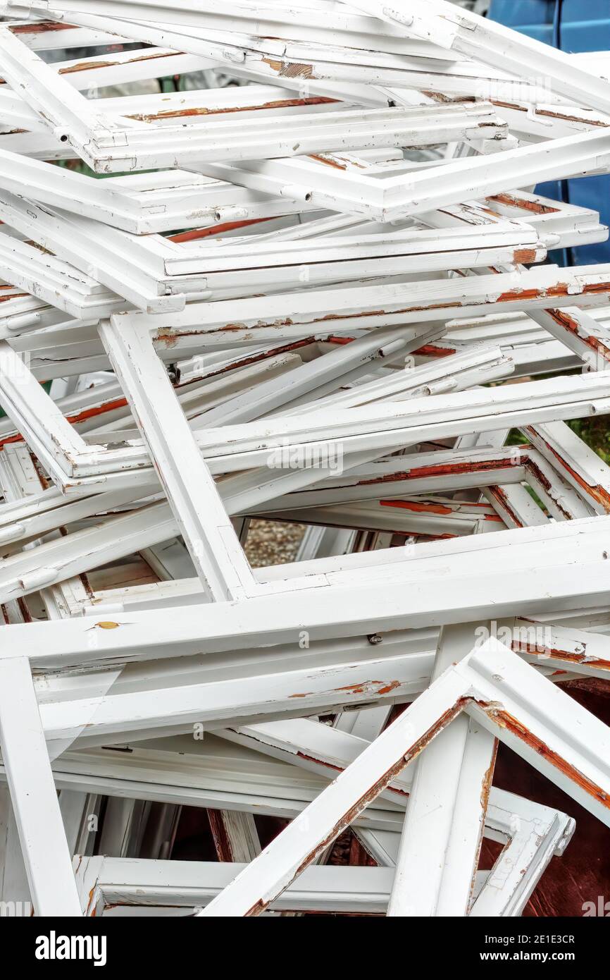 Construction and reconstruction concept, replacing windows. Heap of old