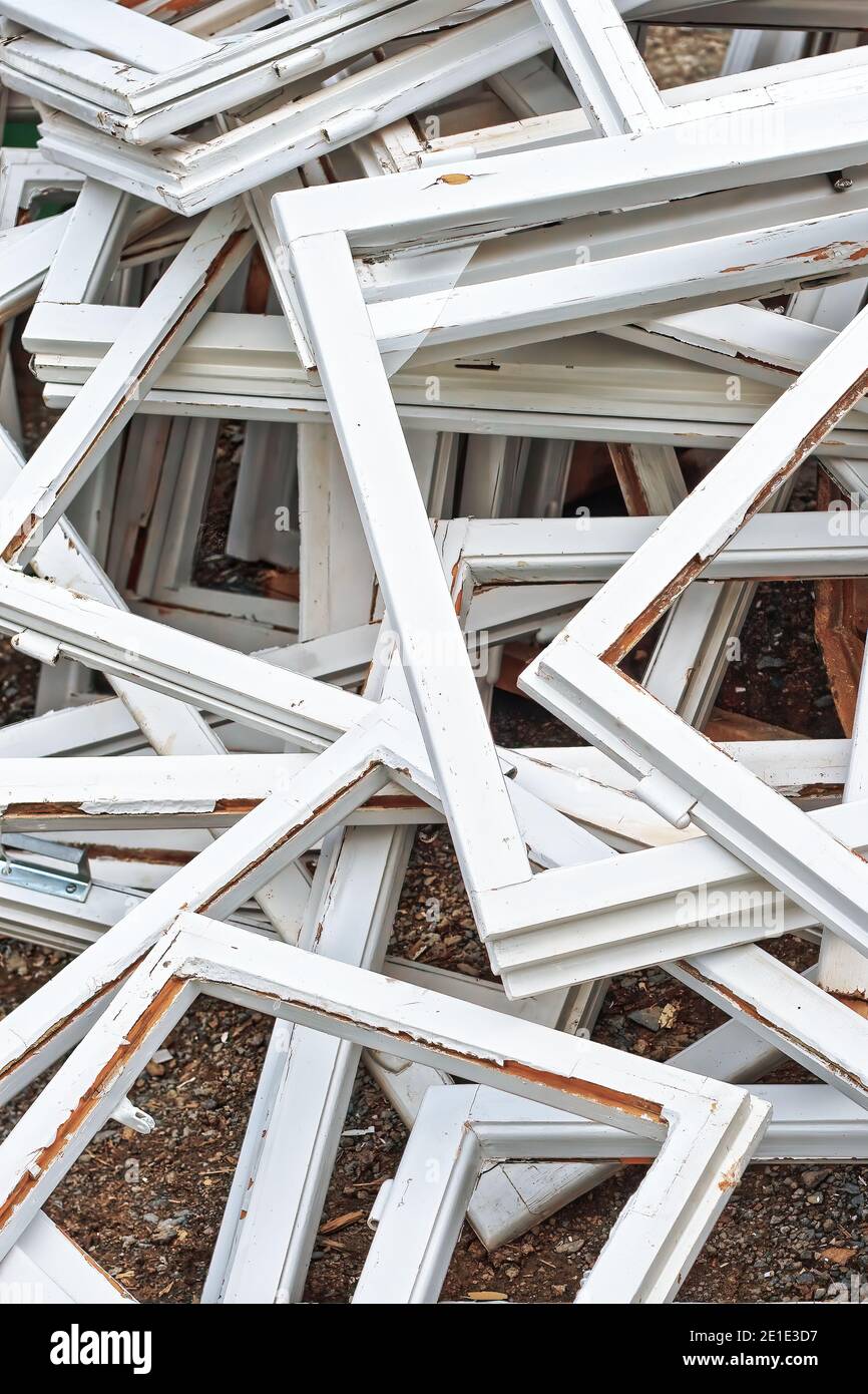 Construction and reconstruction concept, replacing windows. Heap of old