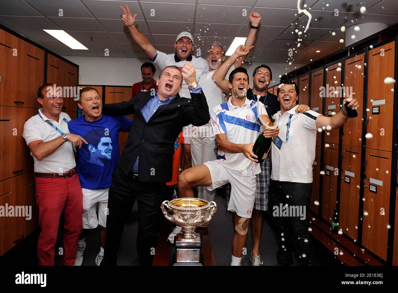 Serbia's Novak Djokovic celebrates with his trophy after defeating Great Britain's Andy Murray 6-4, 6-2, 6-3, during Men's Australian Open tennis tournament in Melbourne, Australia on January 30, 2011. Photo by Ben Solomon/ABACAPRESS.COM Stock Photo
