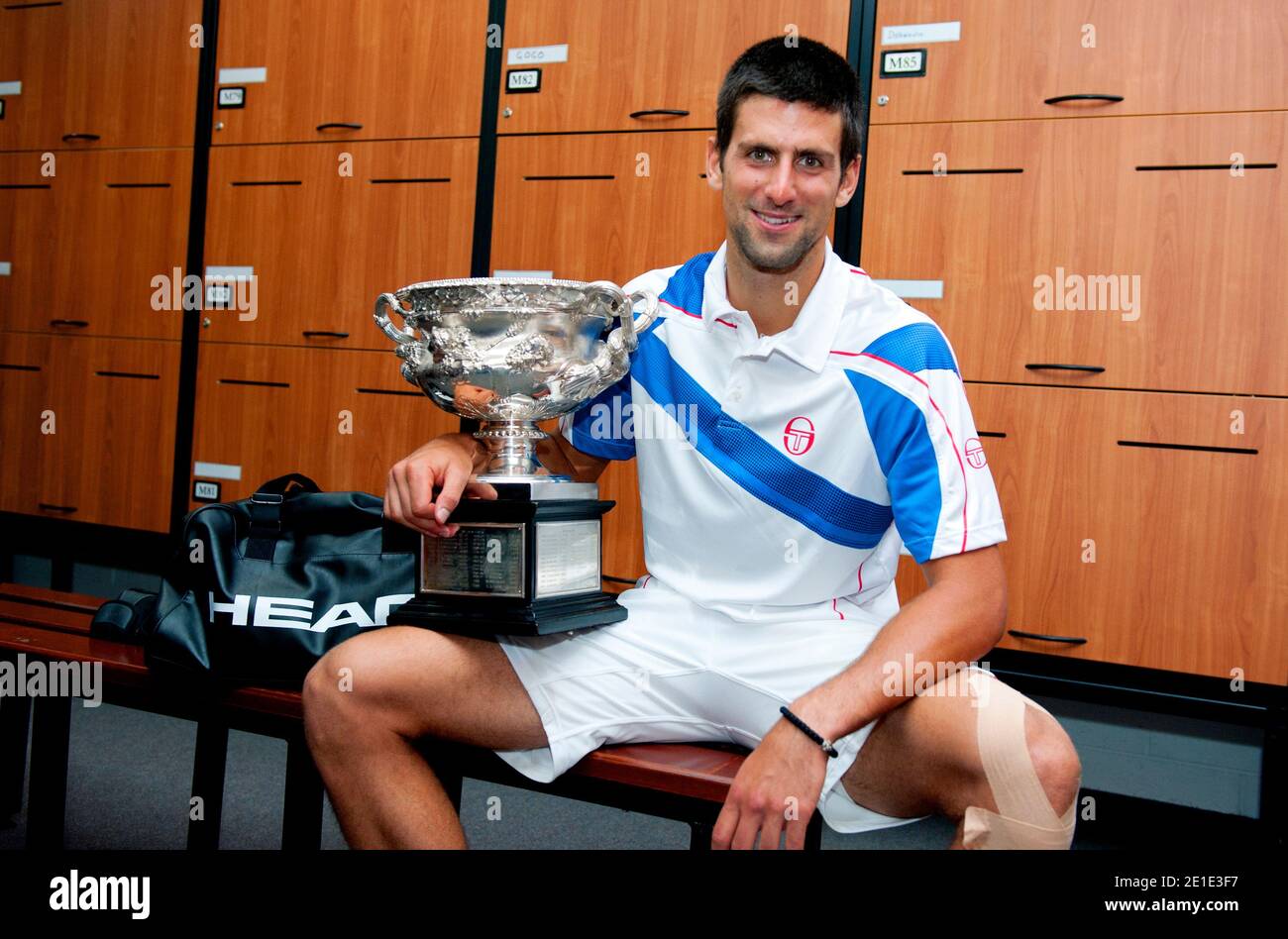 Serbia's Novak Djokovic celebrates with his trophy after defeating Great Britain's Andy Murray 6-4, 6-2, 6-3, during Men's Australian Open tennis tournament in Melbourne, Australia on January 30, 2011. Photo by Ben Solomon/ABACAPRESS.COM Stock Photo