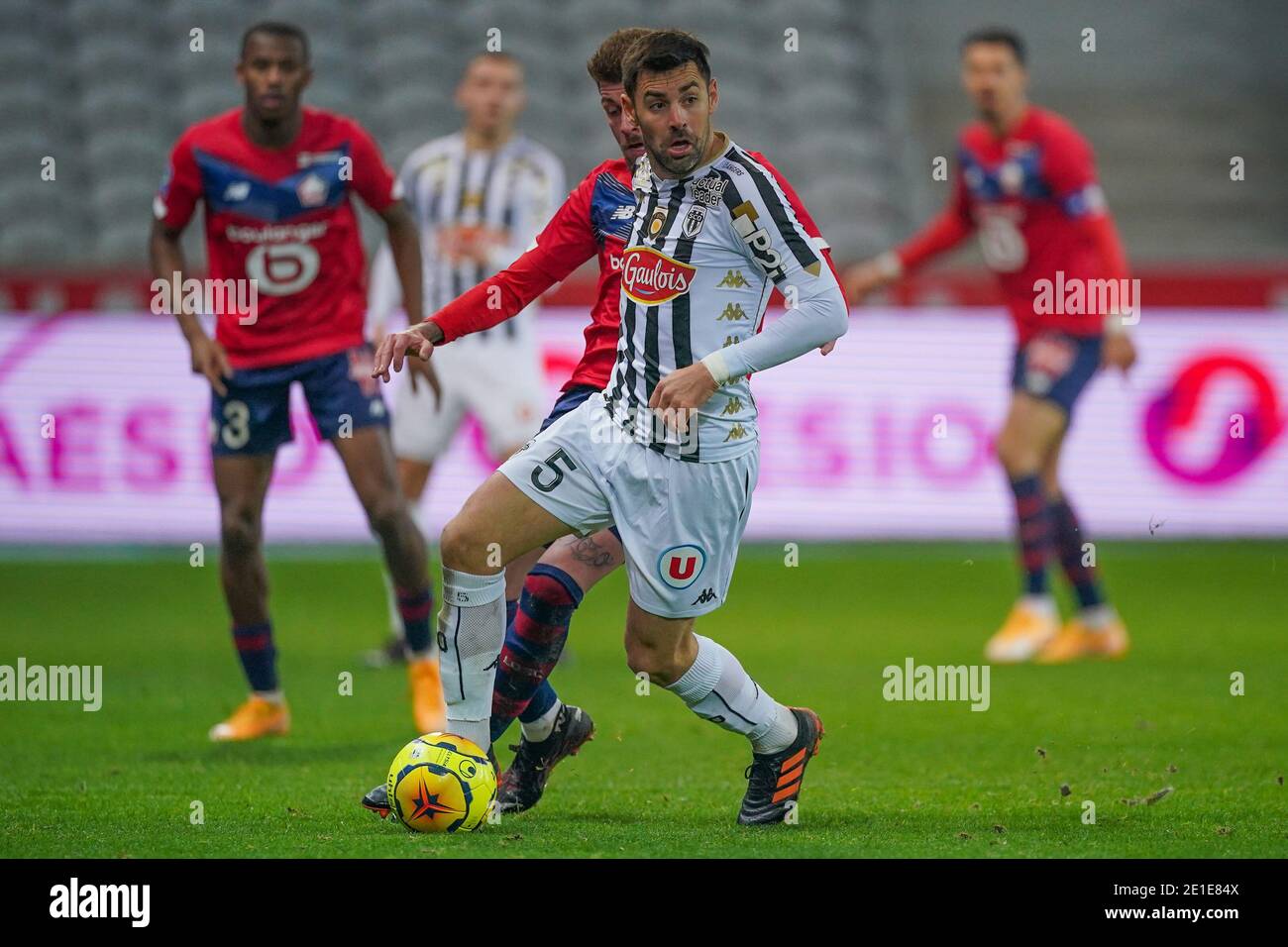 LILLE, FRANCE - JANUARY 6: Xeka of Lille OSC, Thomas Mangani of Angers SCO during the Ligue 1 match between Lille OSC and Angers SCO at Stade Pierre Mauroy on January 6, 2021 in Lille, France (Photo by Jeroen Meuwsen/BSR Agency/Alamy Live News)*** Local Caption *** Xeka, Thomas Mangani Stock Photo