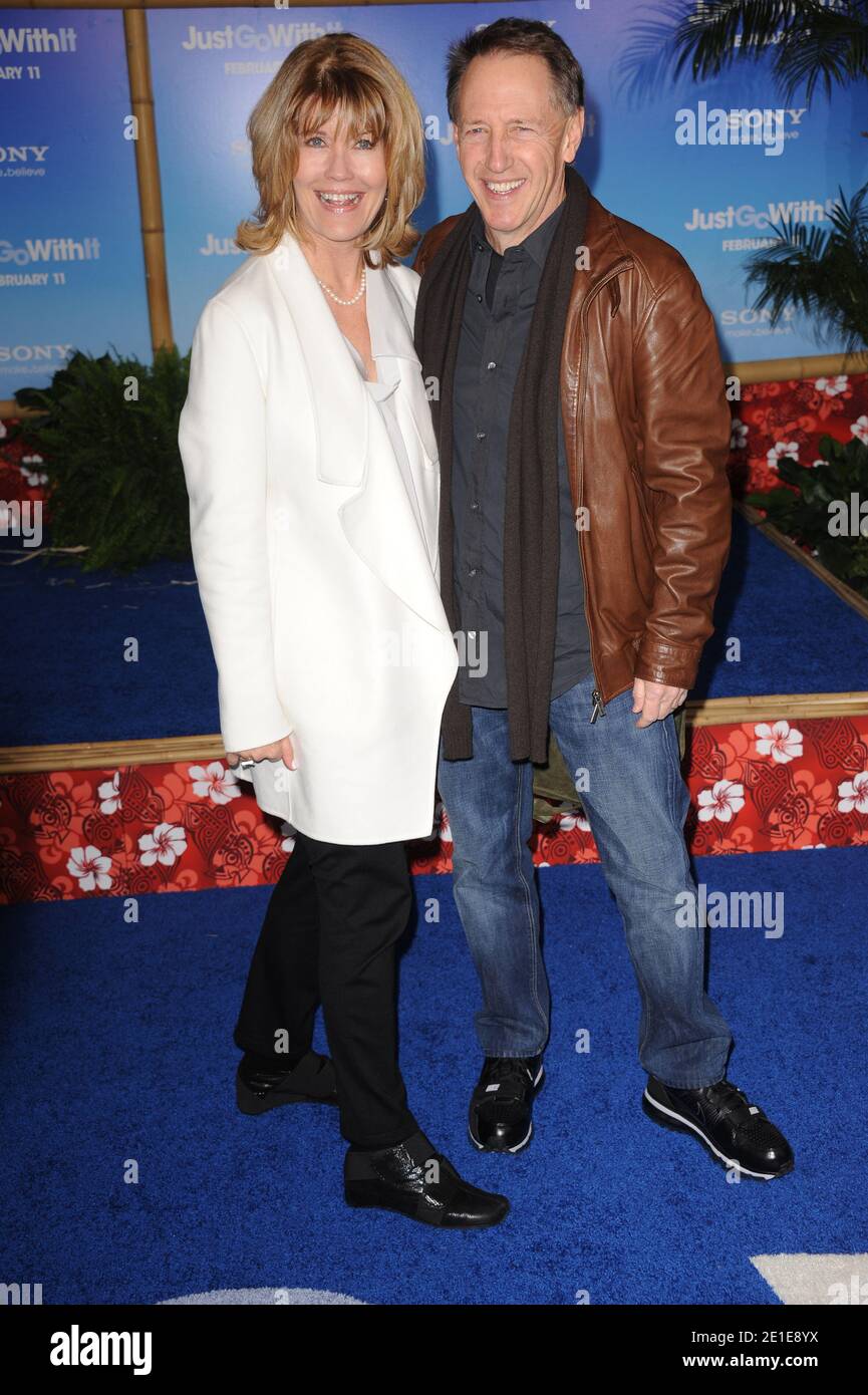 Dennis Dugan (R) and wife attend the premiere of 'Just Go With It' at the Ziegfeld Theatre in New York City, NY, USA on February 8, 2011. Photo by Mehdi Taamallah/ABACAUSA.com Stock Photo