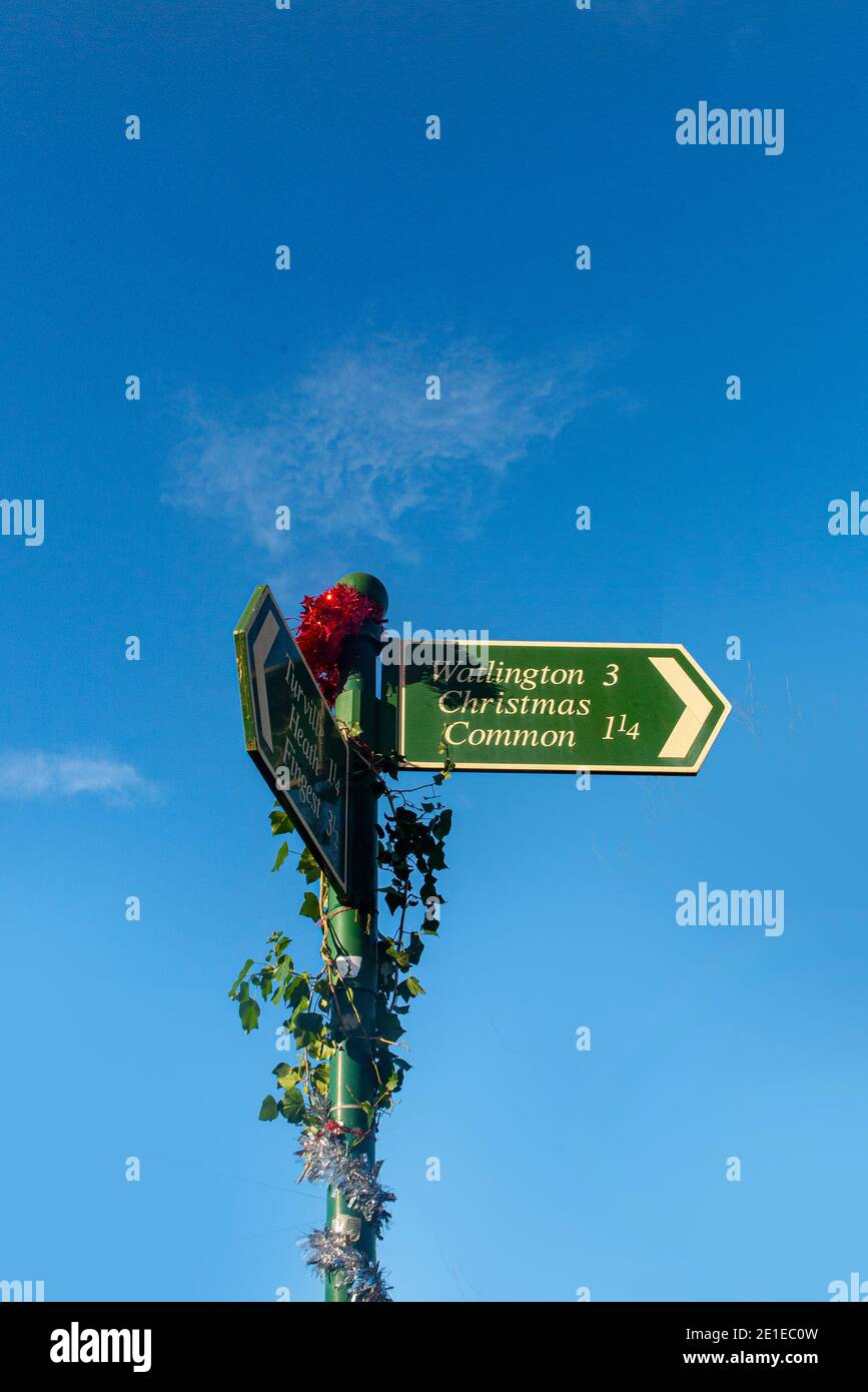 Beautiful Christmas decorations on a signpost in the village of