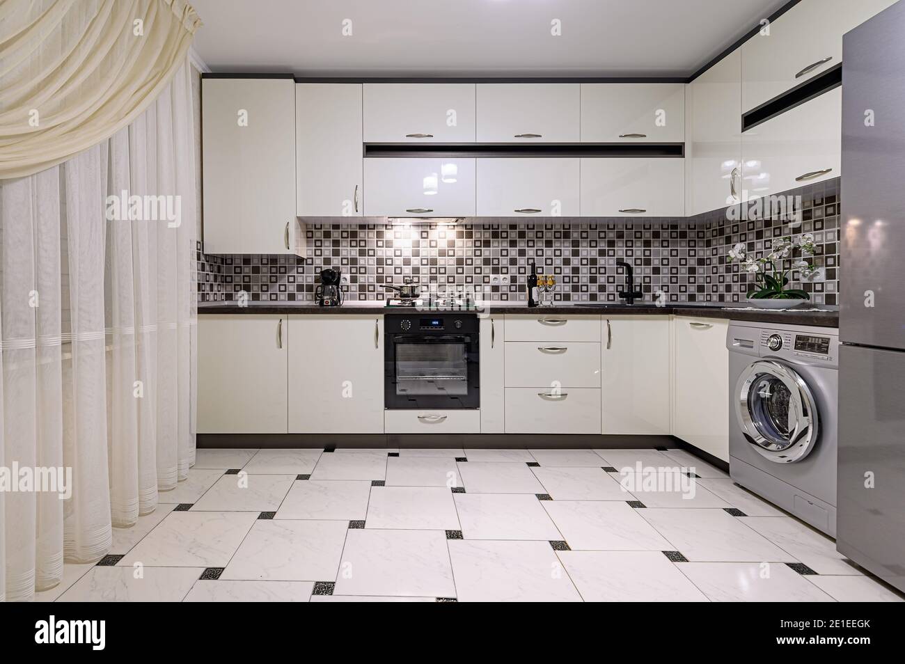 Brown and white modern kitchen interior Stock Photo - Alamy