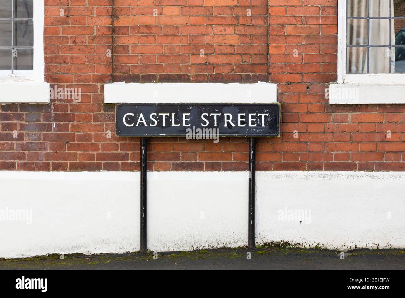 Old metal black and white street sign, Castle Street in Warwick, UK Stock Photo
