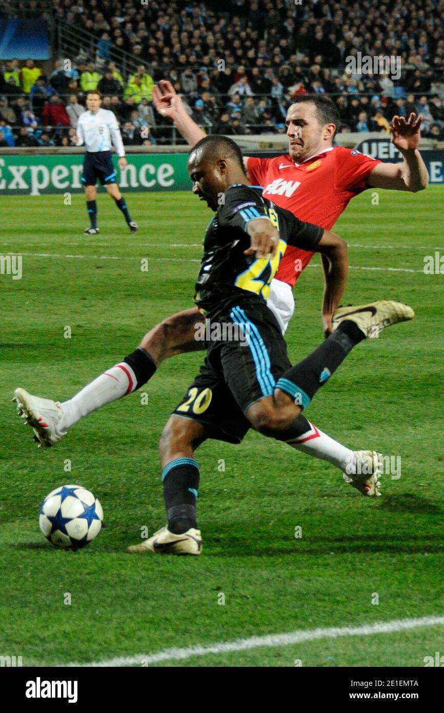 Andre Ayew of Marseille and John O Shea of Man Utd during the Champions League match between Olympique de Marseille and Manchester United FC at Stade Velodrome on February 23 2011 in Marseille