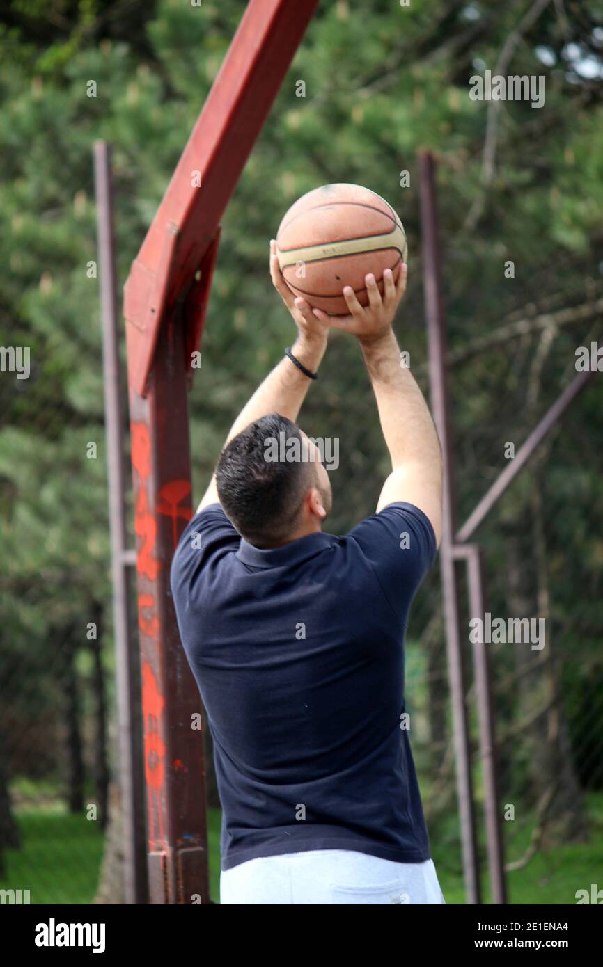 man playing basketball Stock Photo