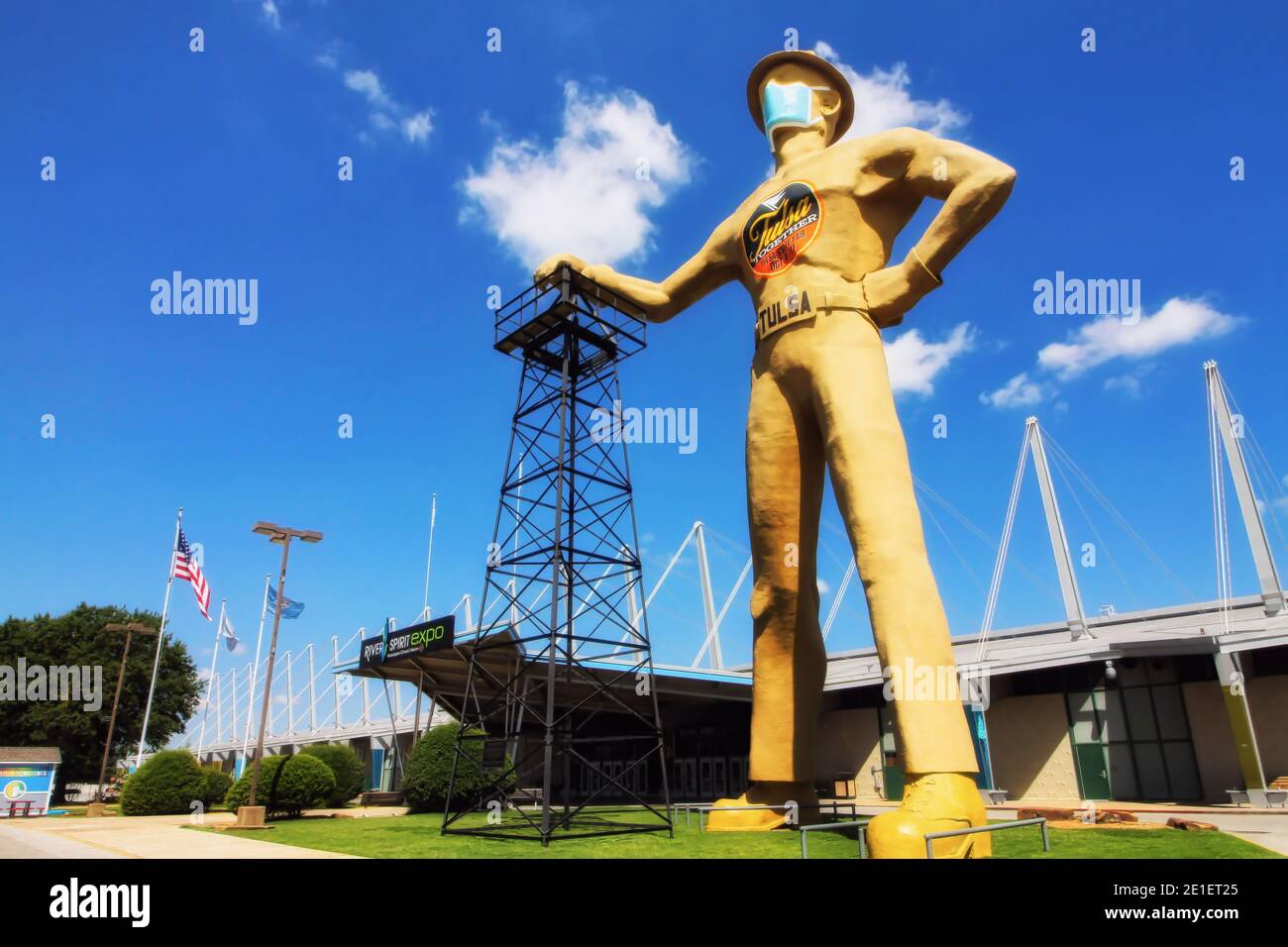 Tulsa Oklahoma's iconic Golden Driller statue wears a mask during the