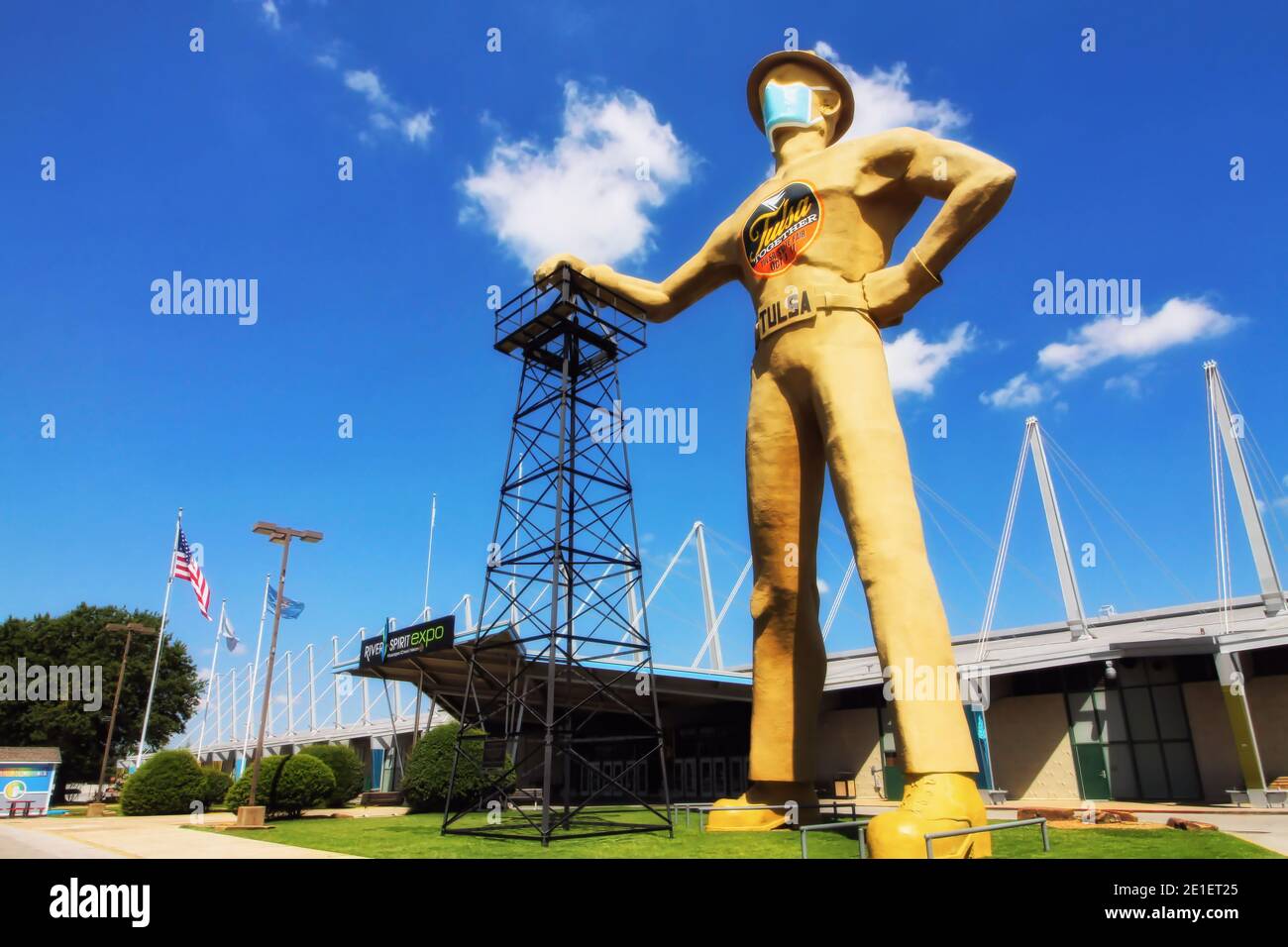 Tulsa Oklahoma's iconic Golden Driller statue wears a mask during the pandemic. Stock Photo