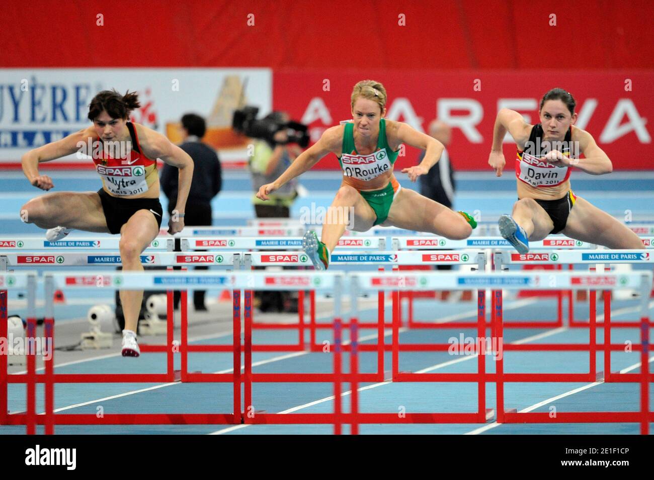 Carolin Nytra of Germany, Derval O'Rourke of Ireland and Elisabeth Davin of Belgium compete in the Women's 60m hurdles heat 4 during day 1 of the 31st European Athletics Indoor Championships at the Palais Omnisports de Paris-Bercy in Paris, France on March 4, 2011. Photo by Stephane Reix/ABACAPRESS.COM. Stock Photo