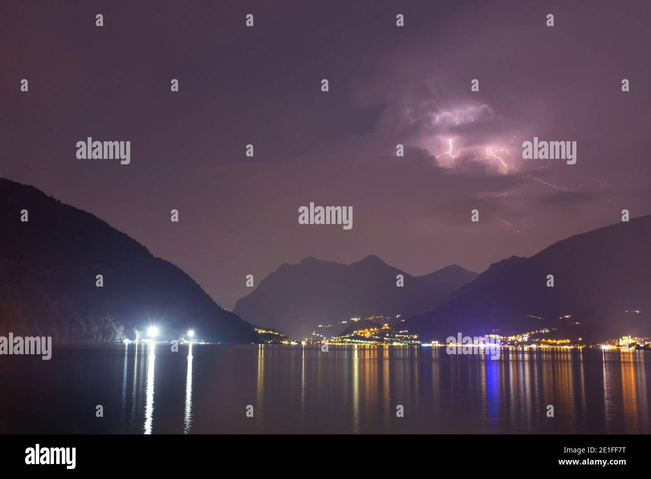 A lightning storm over lake Sulzano, Italy Stock Photo
