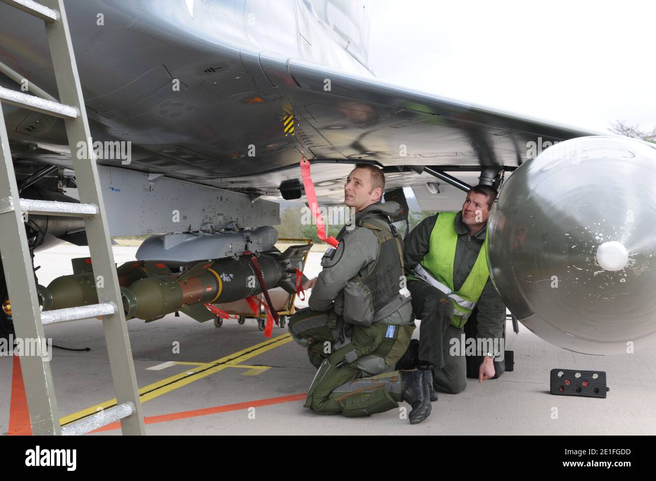 French air force personnel mounted a GBU12 bomb on a Mirage 2000D plane prior to take off from Nancy military base, France, on March 19, 2011, on a mission to overfly Libya following UN Security Council resolution. Photo by ECPAD/ABACAPRESS.COM Stock Photo
