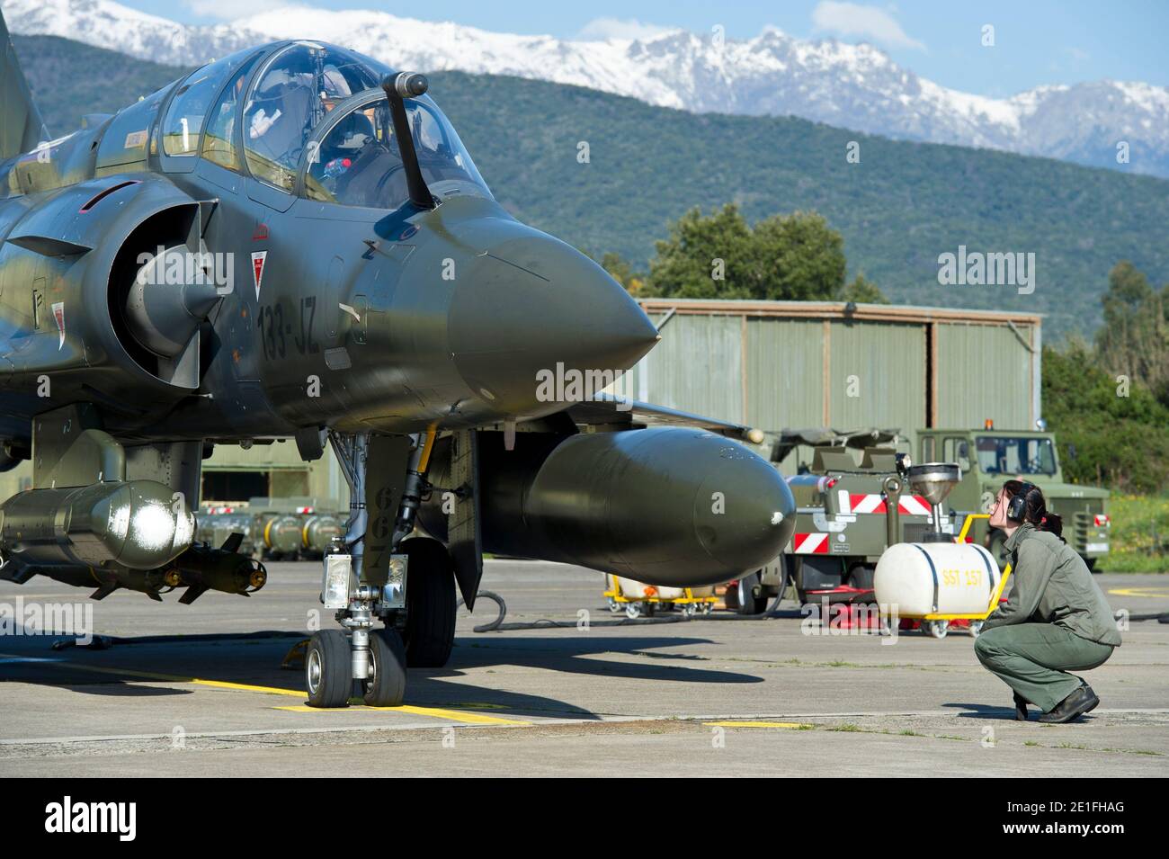 French Mirage 2000 jet fighter of the French army (Nancy military base) is  seen as it leaves the aerial military base of Solenzara in Corsica, France  on March 21, 2011 on a