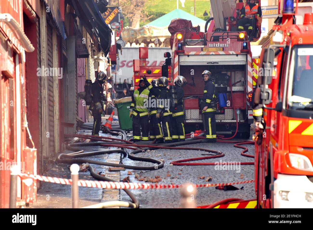 Smoke rises near the Sacre-Coeur de Montmartre basilica, in Paris, France on March 22, 2011, from the Elysee Montmartre music hall where a fire broke out this morning. The cabaret, created in the XVIIIth century, is one of the birth places of famous French Cancan. Photo by ABACAPRESS.COM Stock Photo