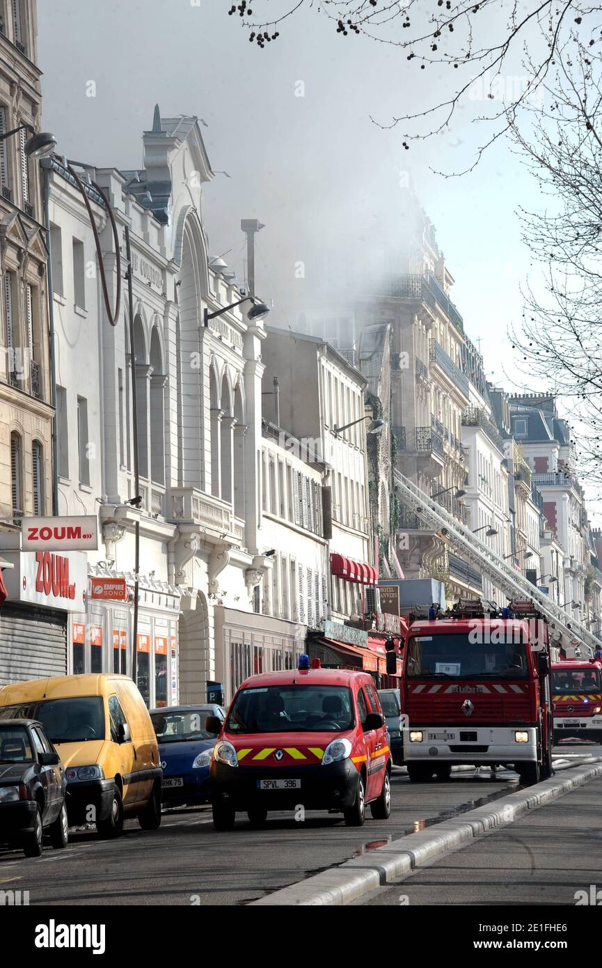 Smoke rises near the Sacre-Coeur de Montmartre basilica, in Paris, France on March 22, 2011, from the Elysee Montmartre music hall where a fire broke out this morning. The cabaret, created in the XVIIIth century, is one of the birth places of famous French Cancan. Photo by ABACAPRESS.COM Stock Photo