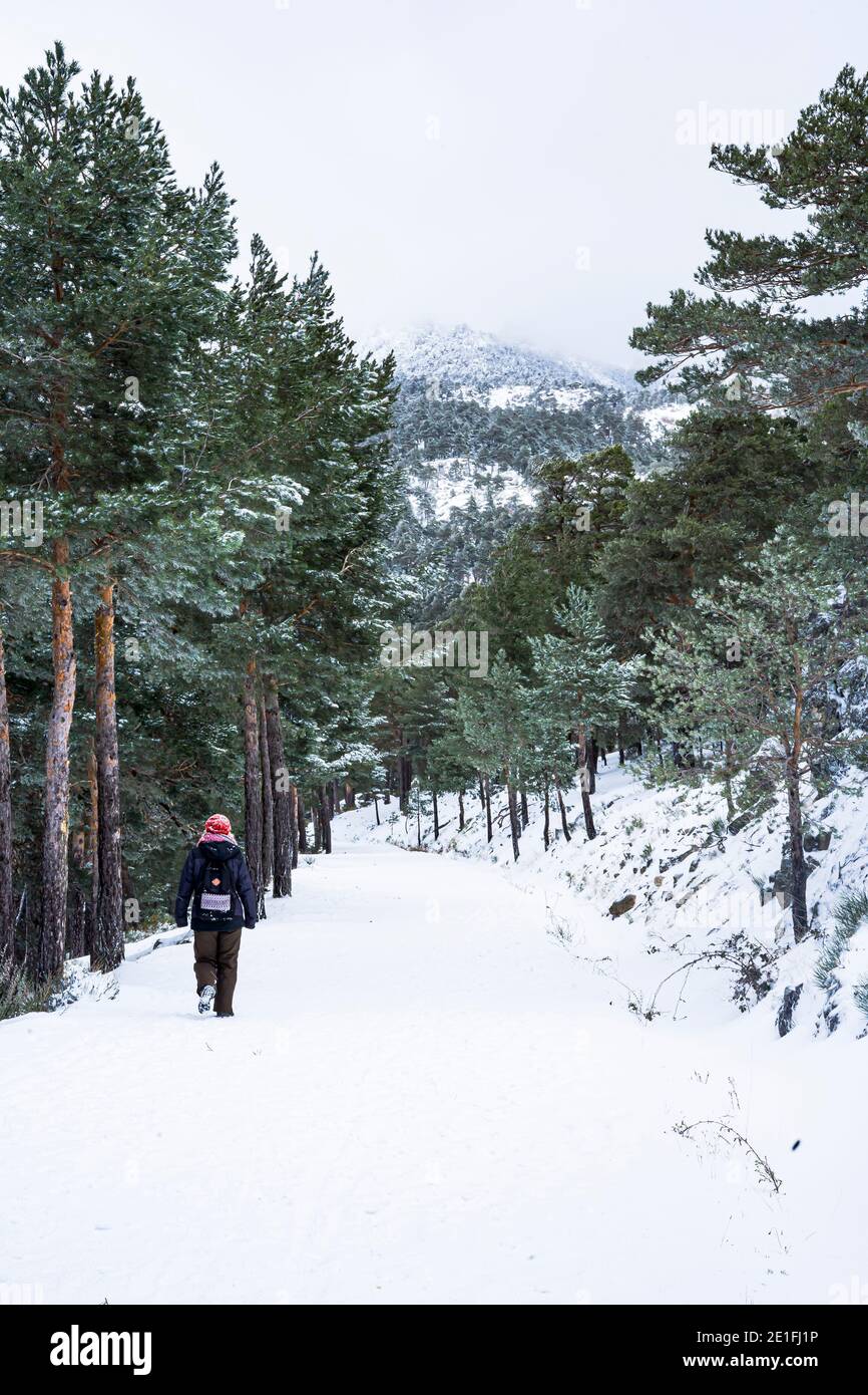 woman walking on the snowy mountain Stock Photo - Alamy