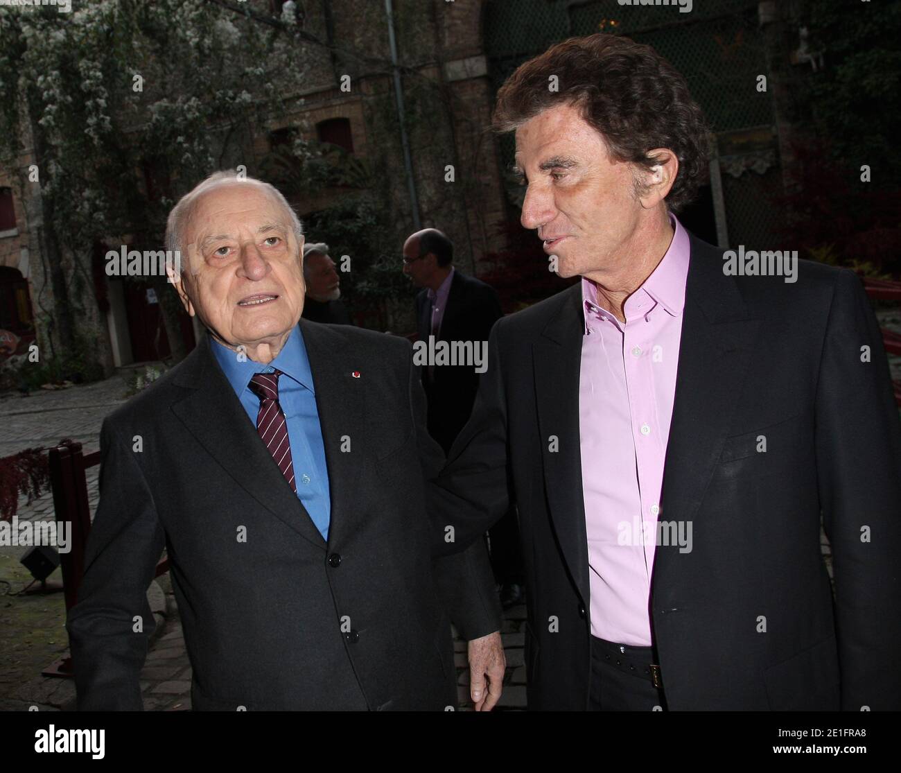 Alain Delon and Pierre Berge arriving at the Louis Vuitton art museum  inauguration, a week before its official opening to the public, on October  20, 2014 in Paris, France. Photo by ABACAPRESS.COM Stock Photo - Alamy