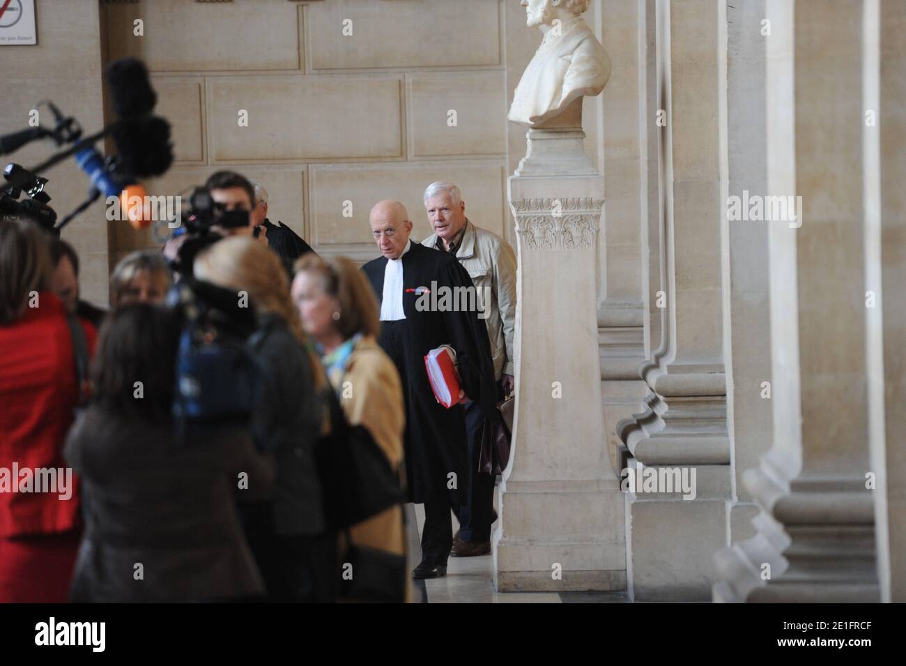 Frenchman Andre Bamberski arrives with his lawyer Francois Gibault at the Palais de Justice to attend German cardiologist Dieter Krombach's trial for the murder of Kalinka Bamberski, in Paris, France on March 29, 2011. The German doctor is accused of having raped and killed his then 14-year-old stepdaughter, Kalinka Bamberski, in the summer of 1982 while she was holidaying with her mother at Krombach's home at Lake Constance, southern Germany. A court in Germany ruled that Krombach could not be held responsible for the death, but in 1995 a court in Paris found the doctor guilty of manslaughter Stock Photo