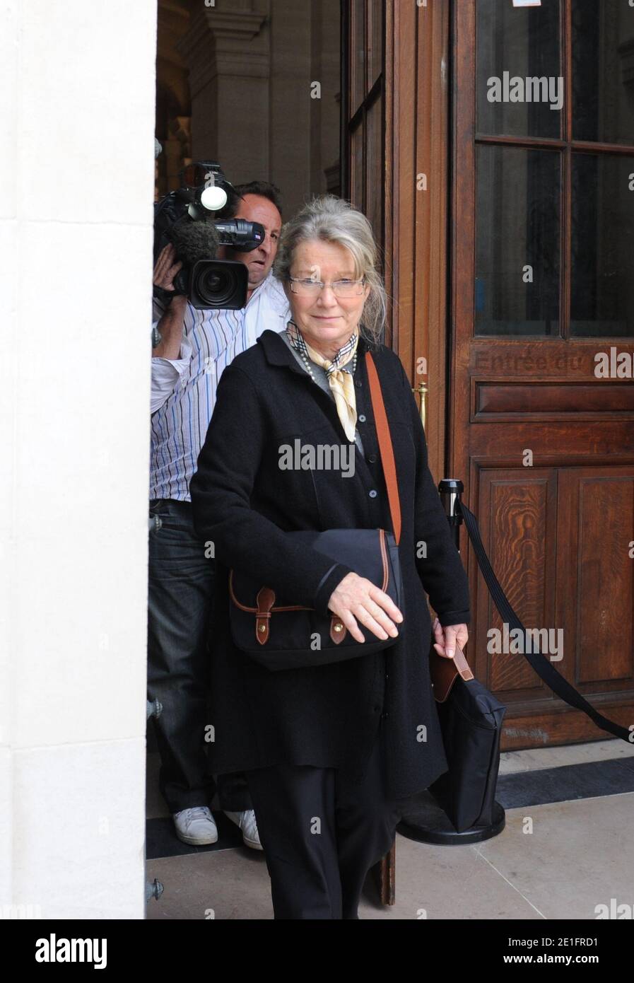Danielle Gonnin, the mother of Kalinka Bamberski, leaves the Palais de Justice after attending the first session of German cardiologist Dieter Krombach's trial for the murder of Kalinka Bamberski, in Paris, France on March 29, 2011. The German doctor is accused of having raped and killed his then 14-year-old stepdaughter, Kalinka Bamberski, in the summer of 1982 while she was holidaying with her mother at Krombach's home at Lake Constance, southern Germany. A court in Germany ruled that Krombach could not be held responsible for the death, but in 1995 a court in Paris found the doctor guilty o Stock Photo
