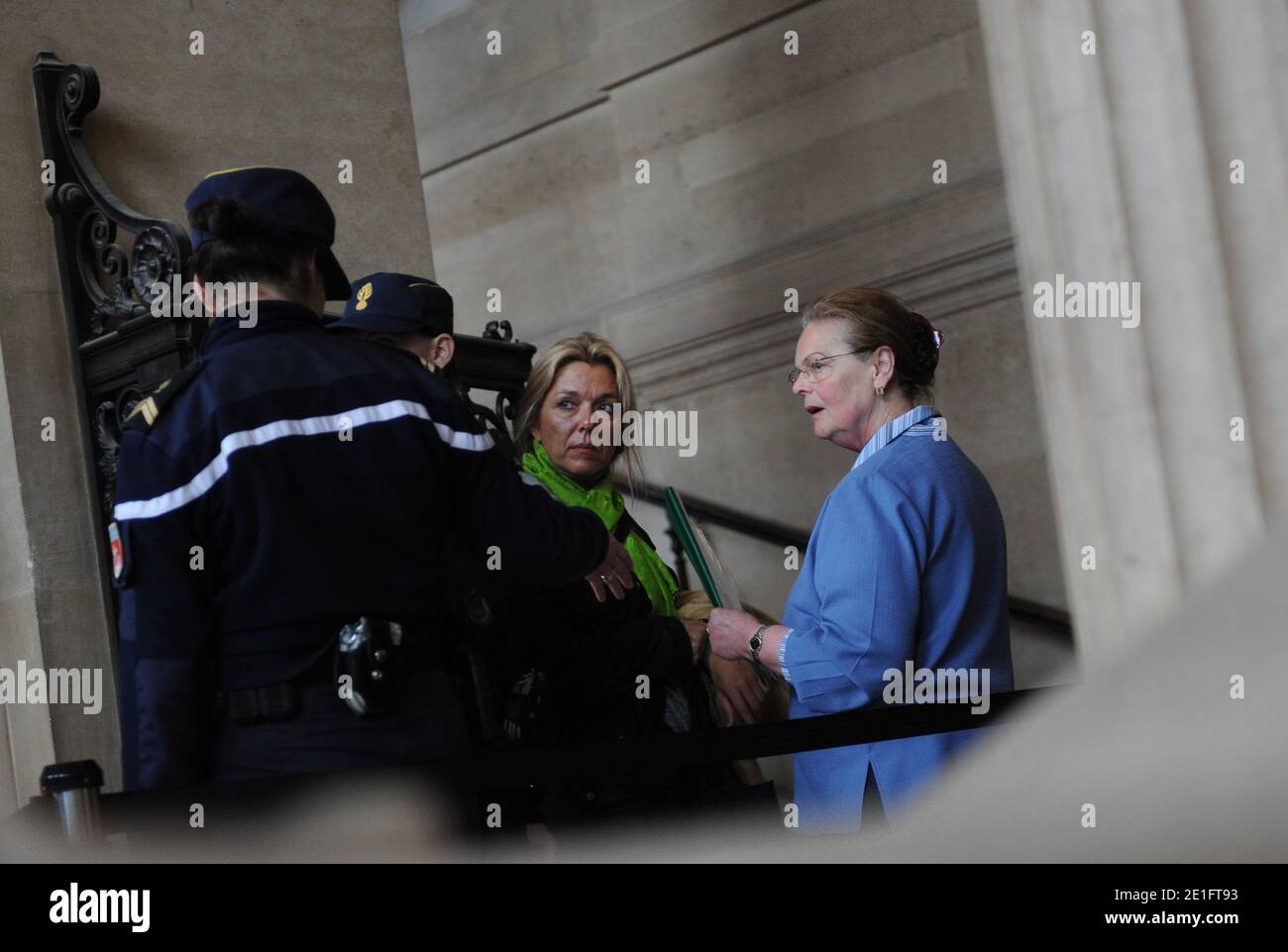 Diana Gunther (C), the daughter of German cardiologist Dieter Krombach, and Krombach's sister (R) at the Palais de Justice where they attended the second day of Krombach's trial for the murder of Kalinka Bamberski, in Paris, France on March 30, 2011. The French court today decided to continue the trial of the German doctor, who is accused of having raped and killed his then 14-year-old stepdaughter, Kalinka Bamberski, in the summer of 1982 while she was holidaying with her mother at Krombach's home at Lake Constance, southern Germany. A court in Germany ruled that Krombach could not be held re Stock Photo