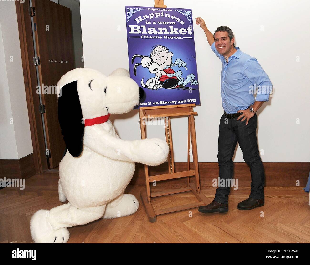 Andy Cohen and Snoopy attend the special screening of "Happiness is a