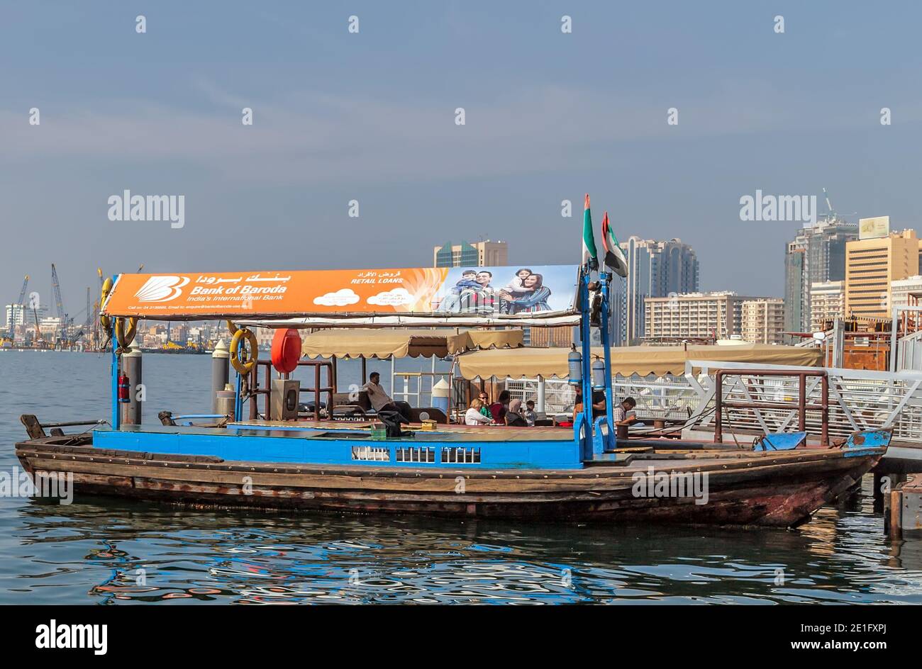 Dubai, UAE - JAN 23, 2016: Boats Abra ferries cruise business on the Bay Creek canal. RTA Abra water taxi station in Deira, United Arab Emirates Stock Photo