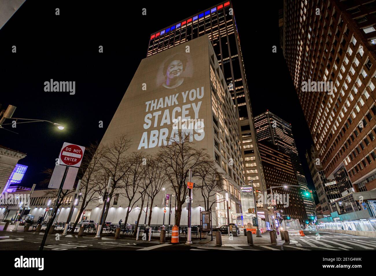 USA. 06th Jan, 2021. Activists with Rainforest Action Network and The Illuminator projected 30ft tall images on the side of a building in the New York financial district on January 6, 2021 with messages celebrating the work of Stacey Abrams on the senate election victories in Georgia. (Photo by Erik McGregor/Sipa USA) Credit: Sipa USA/Alamy Live News Stock Photo