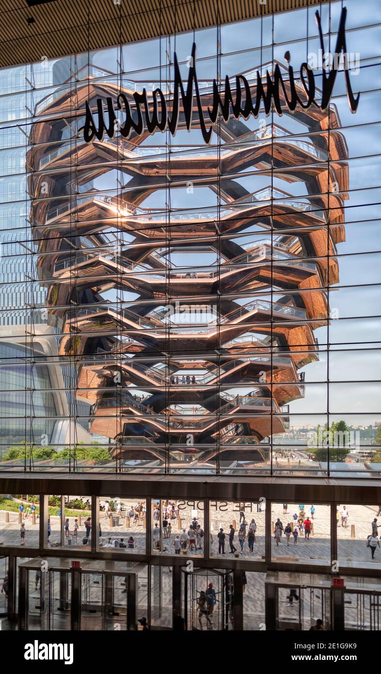 The Vessel, shot through the window of Neiman Marcus, Hudson Yards, New York City, USA. Building completed in 2019. Stock Photo