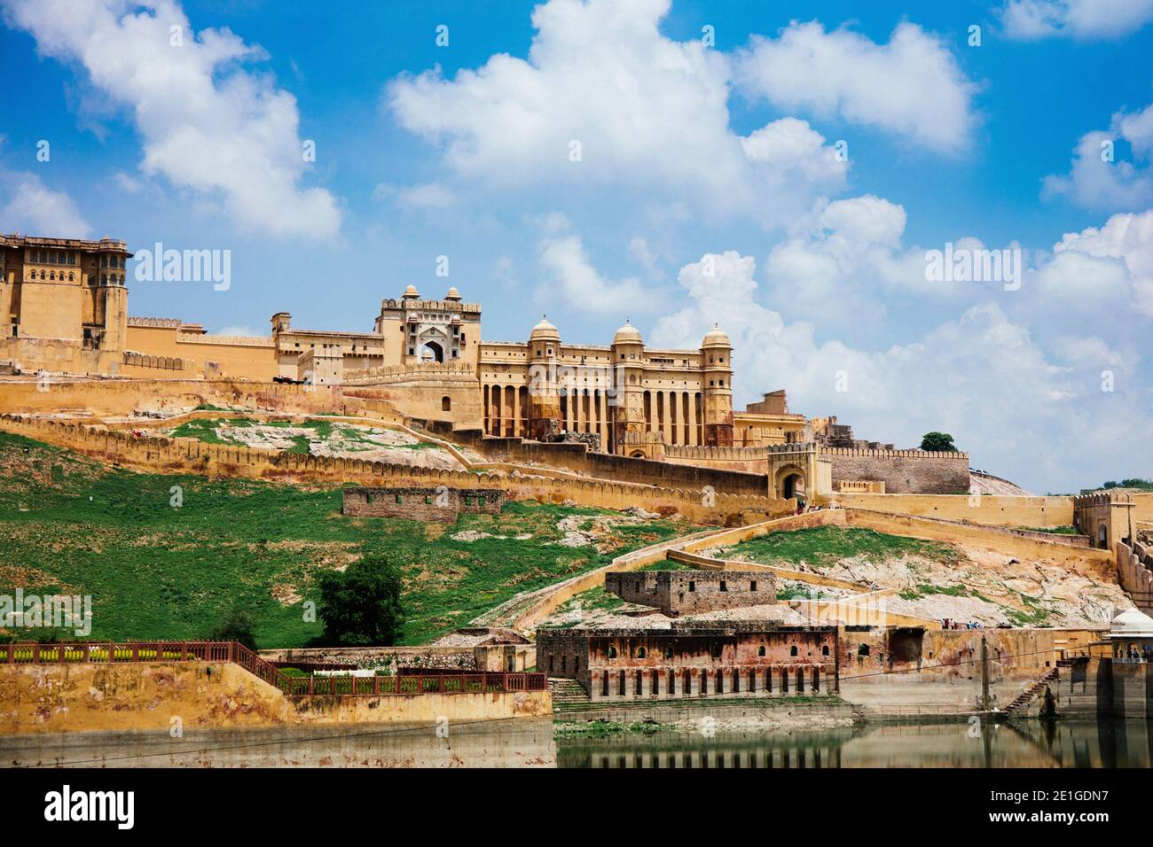 Amer Fort, Amber Fort, Jaipur, hilltop ramparts and series of gates and cobbled paths and lake Maota. Stock Photo