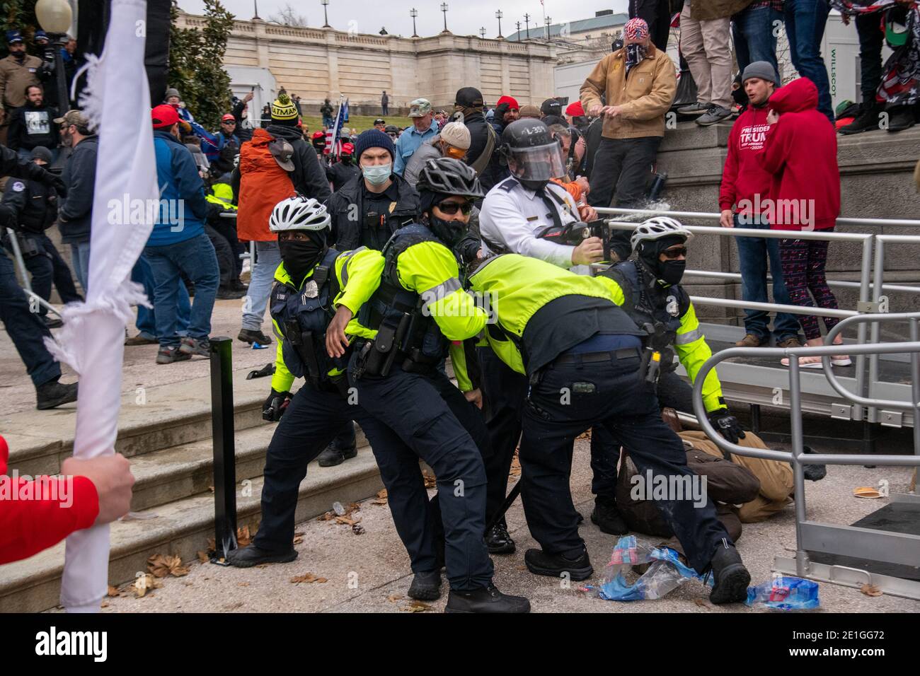 Washington, USA. 06th Jan, 2021. Police make an arrest and deploy pepper spray as supporters of President Trump storm the United States Capitol on January 6, 2021. The joint session of the House and Senate was sent to recess after the breach as it convened to confirm the Electoral College votes cast in November's election. (Photo by Matthew Rodier/SiPA USA) Credit: Sipa USA/Alamy Live News Stock Photo