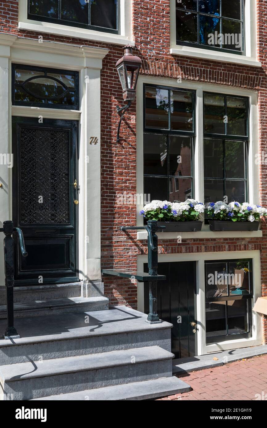 Front facade view of an elegant canal house in Amsterdam, Netherlands. Stock Photo