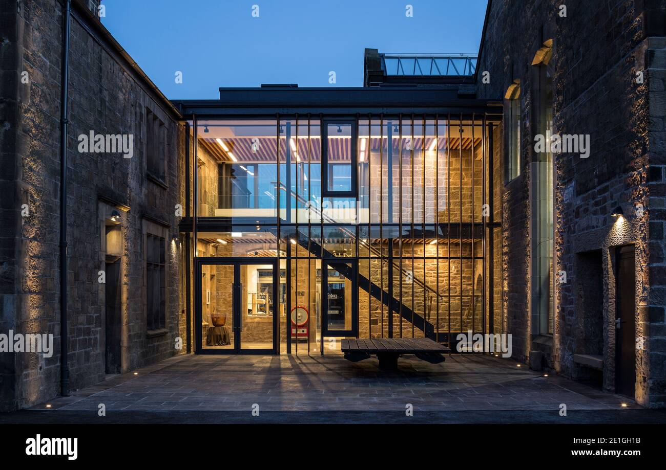 Exterior view of The Borders Distillery, Hawick, Scotland, UK at night. Winner of Architects Journal Retrofit Award 2018 and Civic Trust Award 2019 Stock Photo
