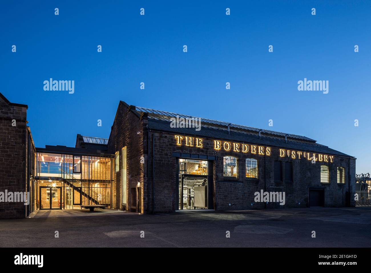 Exterior view of The Borders Distillery, Hawick, Scotland, UK at night. Winner of Architects Journal Retrofit Award 2018 and Civic Trust Award 2019 Stock Photo