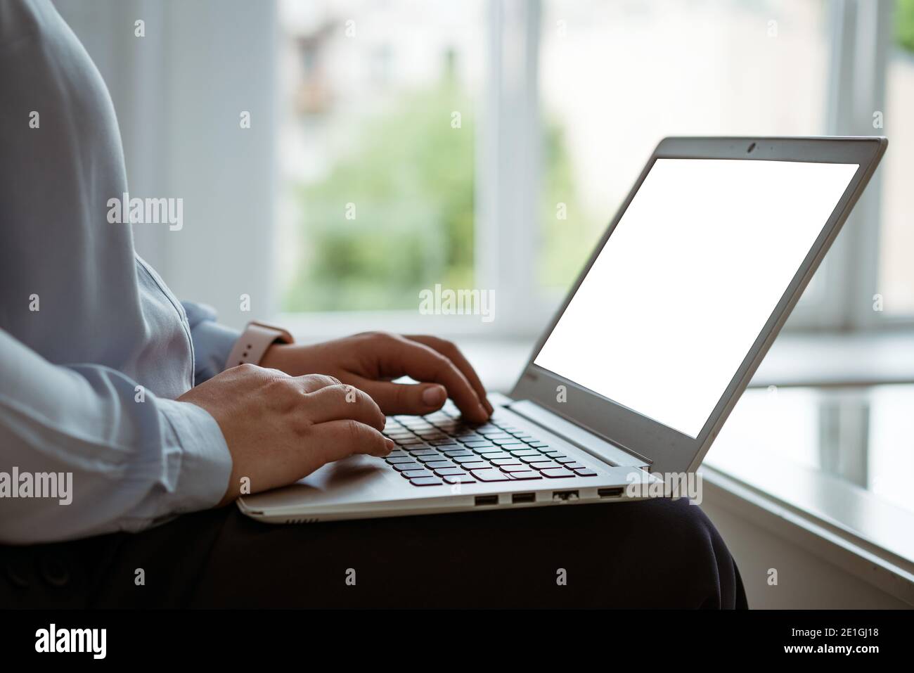 female hands working behind a laptop, without a face Stock Photo - Alamy