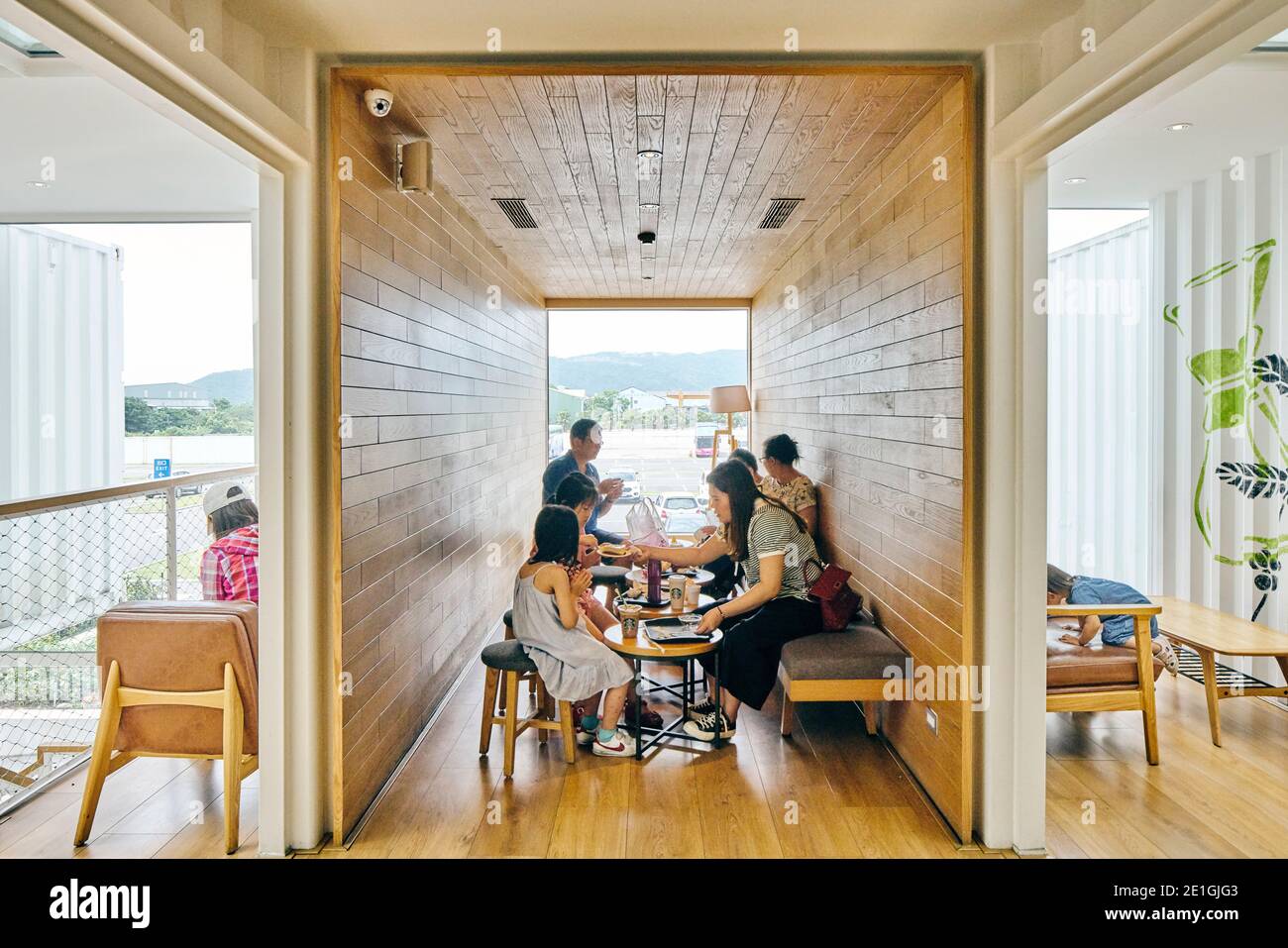 Interior view of the first Starbucks cafe in Asia Pacific, constructed from recycled shipping containers, Hualien Bay Mall, Hualie, Taiwan. Stock Photo