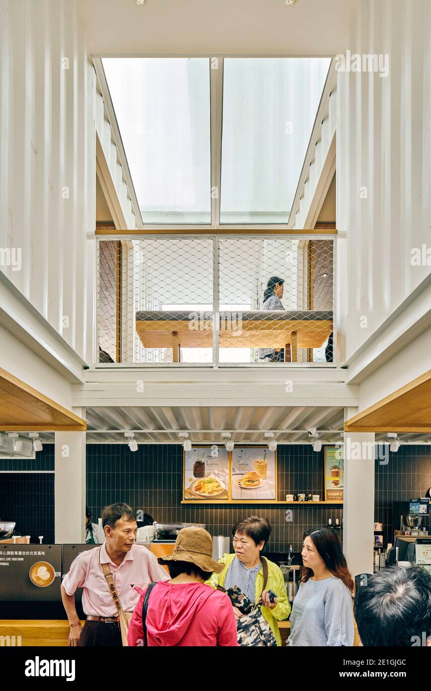 Interior view of the first Starbucks cafe in Asia Pacific, constructed from recycled shipping containers, Hualien Bay Mall, Hualie, Taiwan. Stock Photo