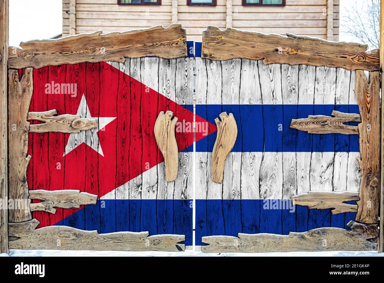 Close-up of the national flag of Cuba  on a wooden gate at the entrance to the closed territory. The concept of storage of goods, entry to a closed ar Stock Photo
