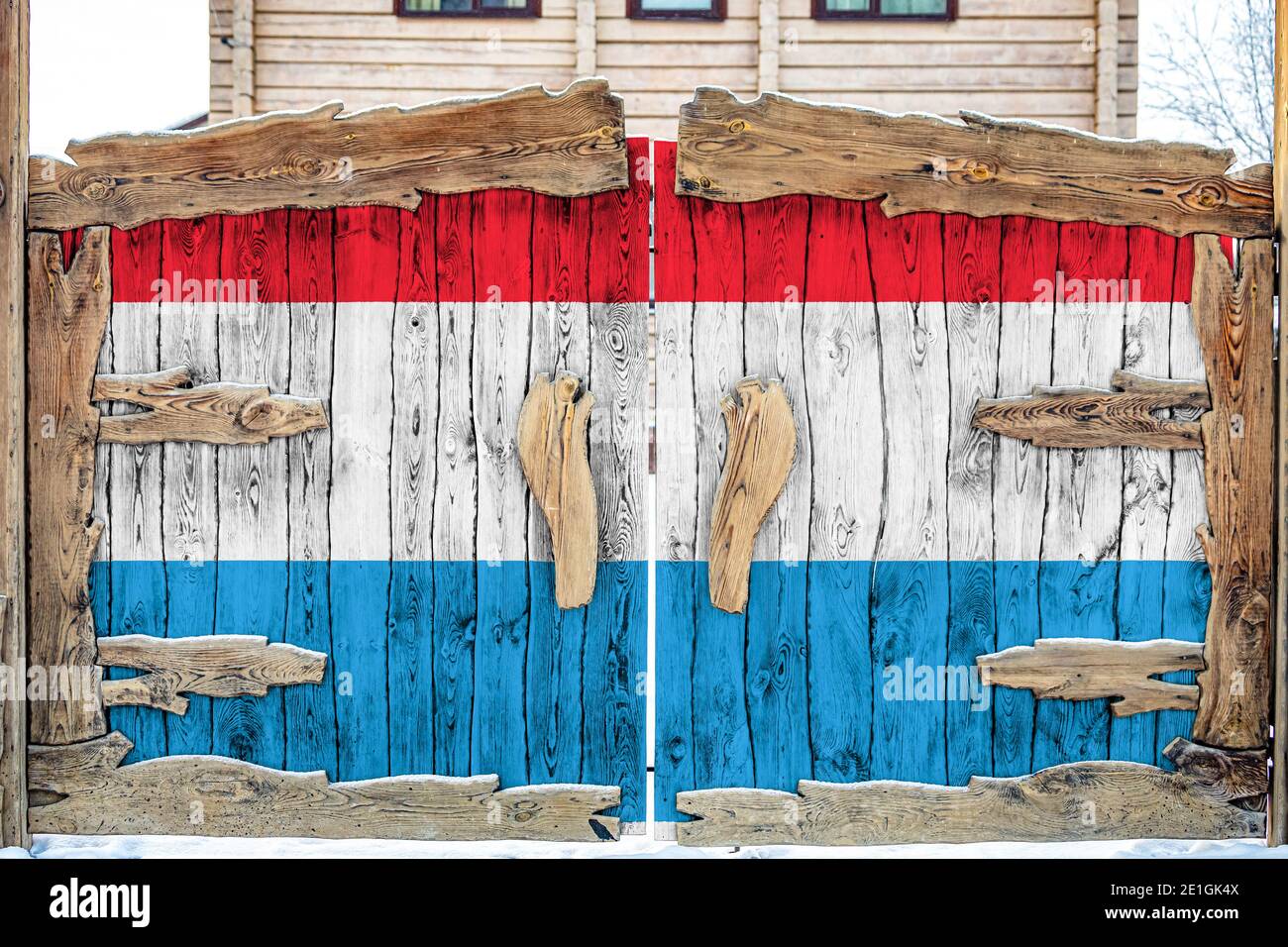 Close-up of the national flag of Luxembourg  on a wooden gate at the entrance to the closed territory. The concept of storage of goods, entry to a clo Stock Photo