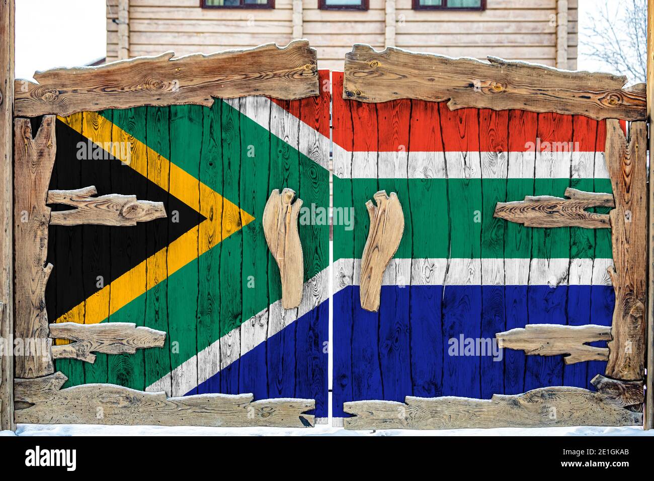 Close-up of the national flag of South African Republic  on a wooden gate at the entrance to the closed territory. The concept of storage of goods, en Stock Photo