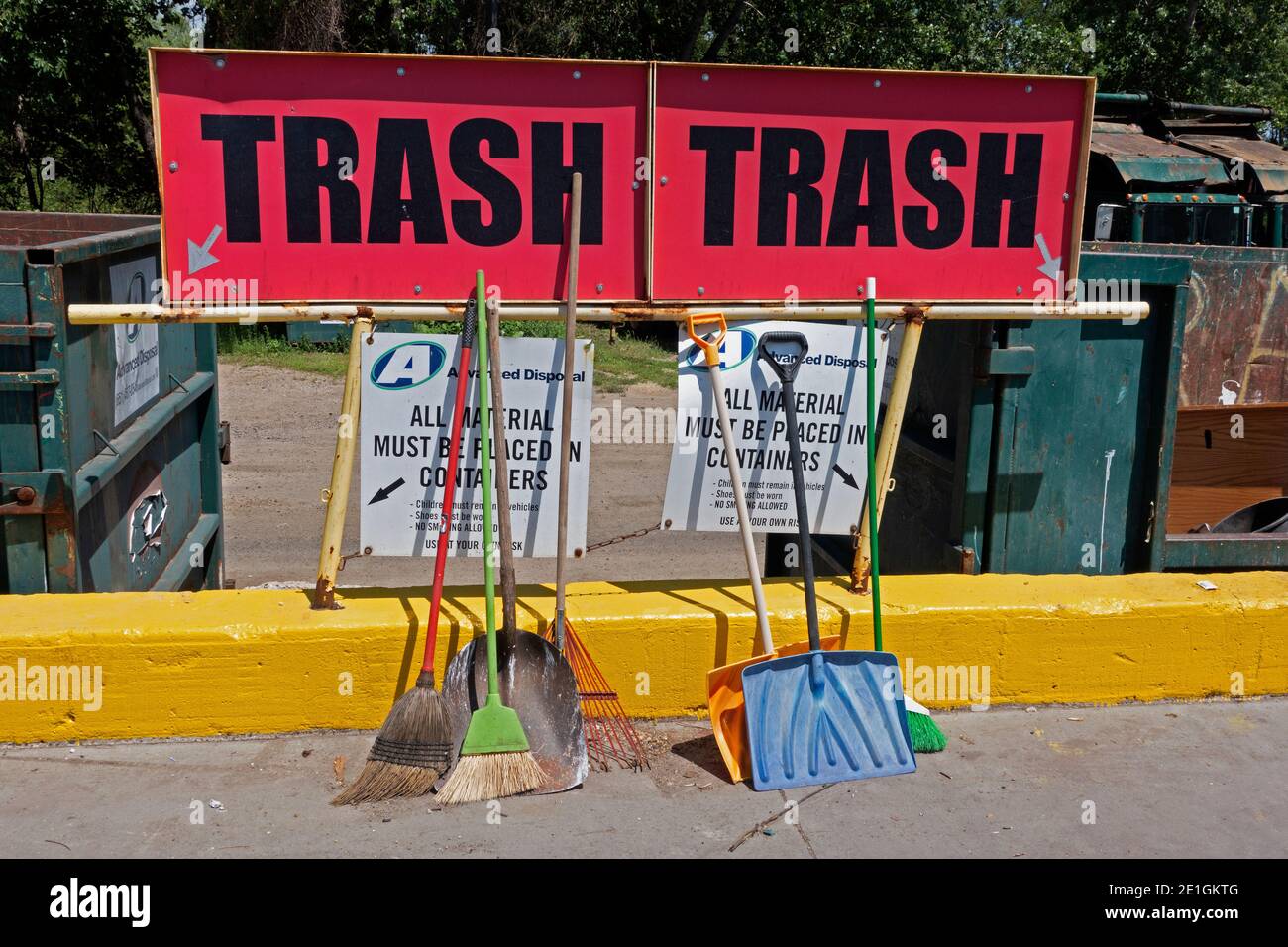 Signs for trash with shovels and brooms at a city dump, a place that will accept and process most unwanted items. St Paul Minnesota MN USA Stock Photo