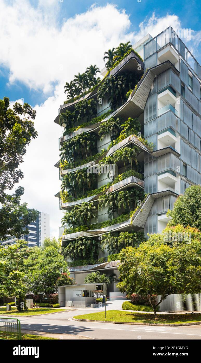 Exterior view of The Oliv, a residential flat development with lush greenery on sky terraces. Stock Photo