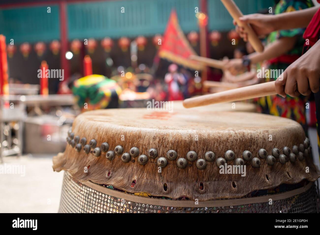 People drumming the Chinese drums to celebrate Lunar New Year Stock Photo