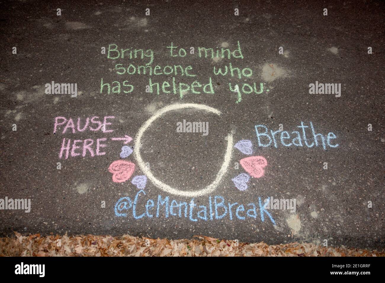 Chalk design on the sidewalk reminding people who pass by to breathe. Sidewalk therapy. St Paul Minnesota MN USA Stock Photo