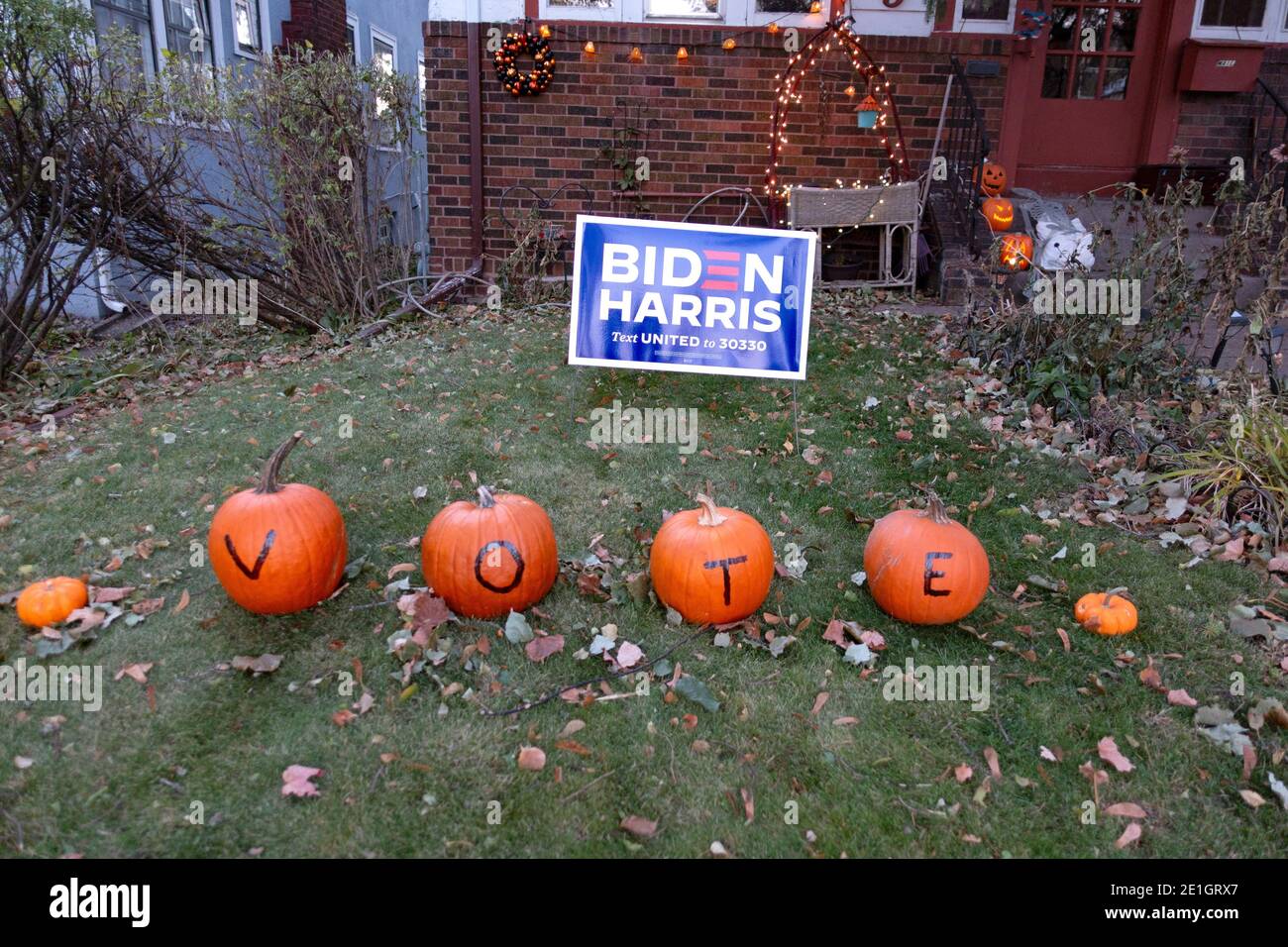 Home with Biden Harris sign and pumpkins saying vote. St Paul Minnesota MN USA Stock Photo
