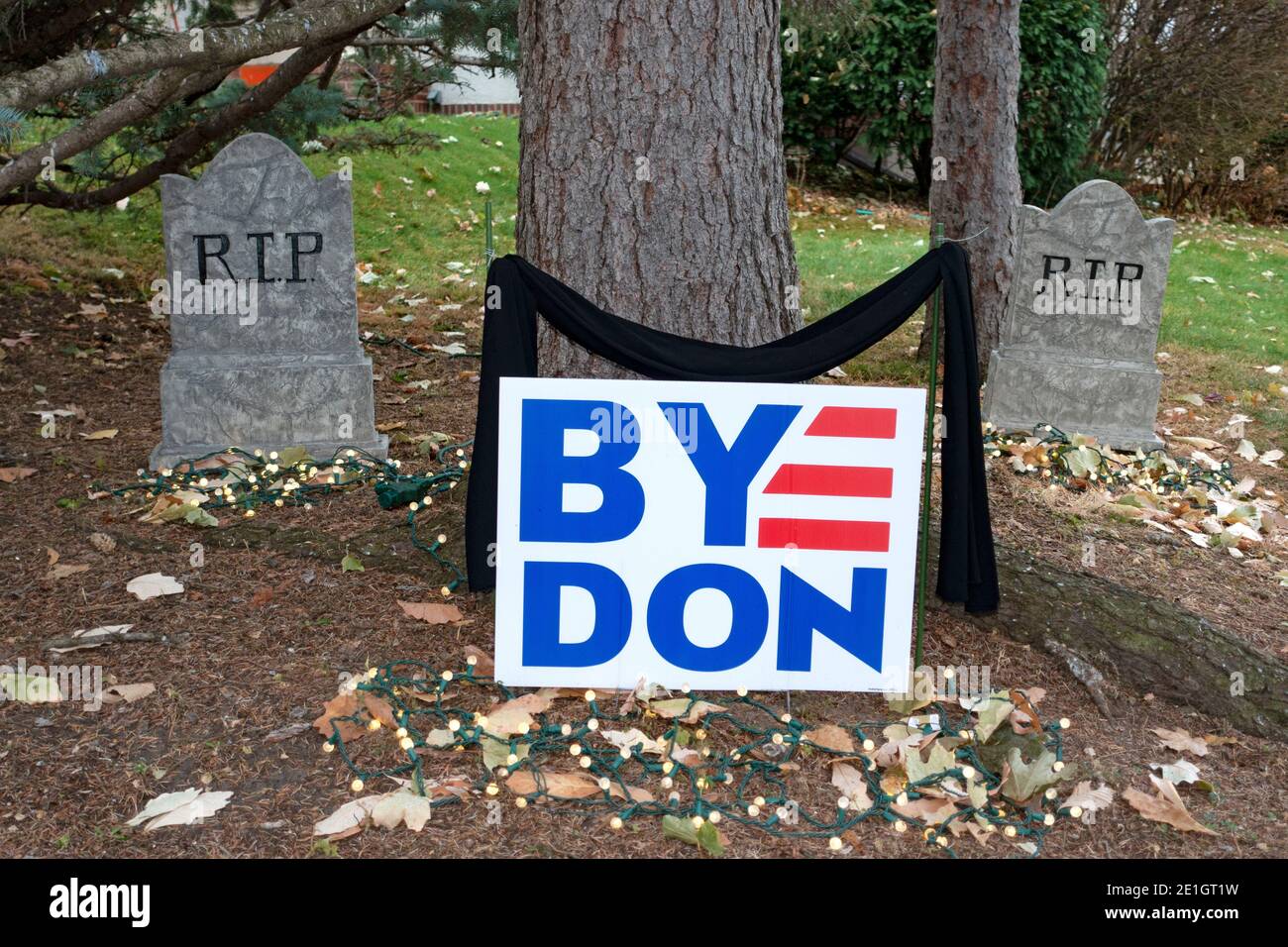 Voting sign 'Bye Don' with suggestive Halloween RIP gravestone decorations on front yard. St Paul Minnesota MN USA Stock Photo