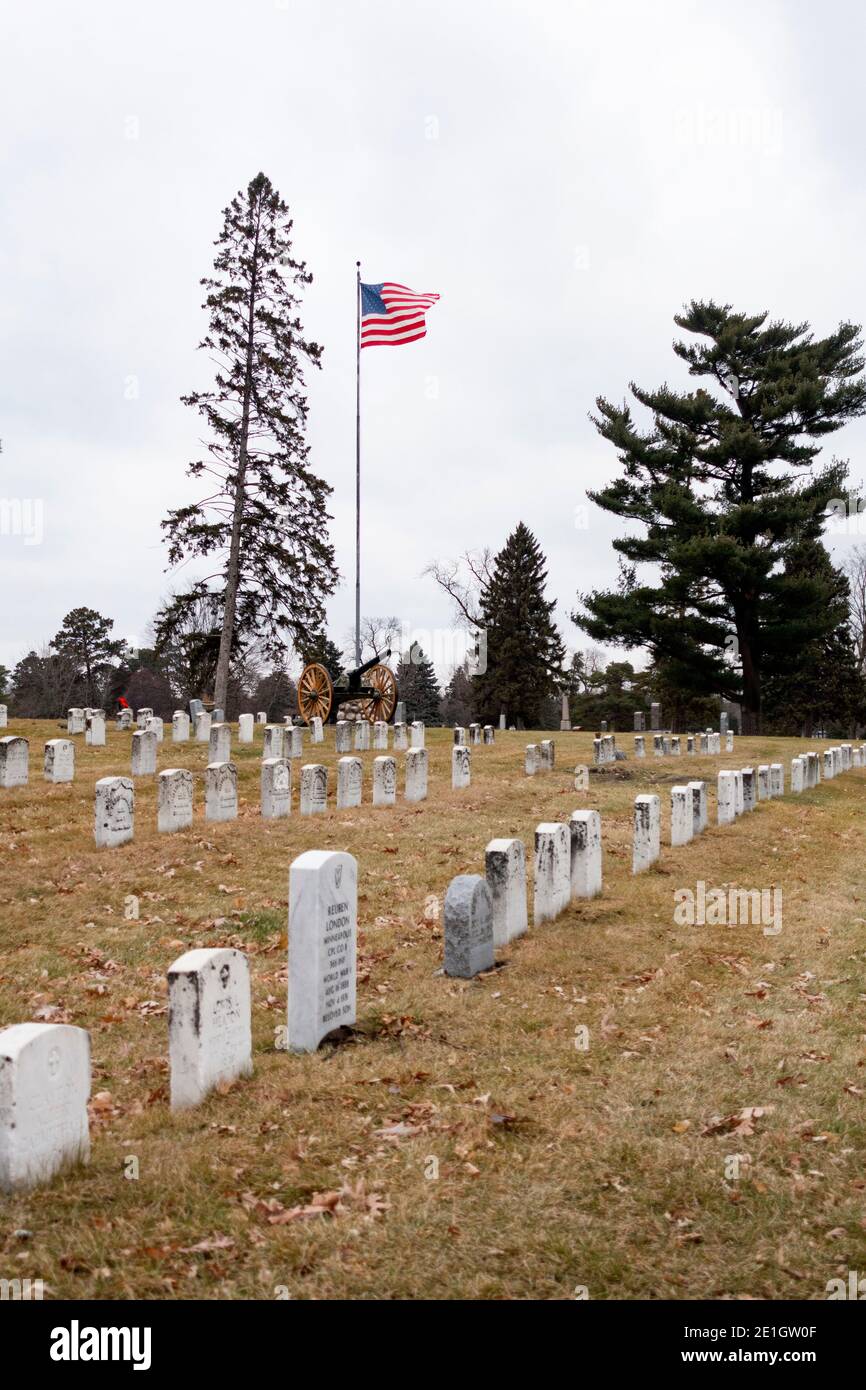 Crystal Lake Cemetery area of graves for World War I Warriors with American flag flying in the breeze. Minneapolis Minnesota MN USA Stock Photo