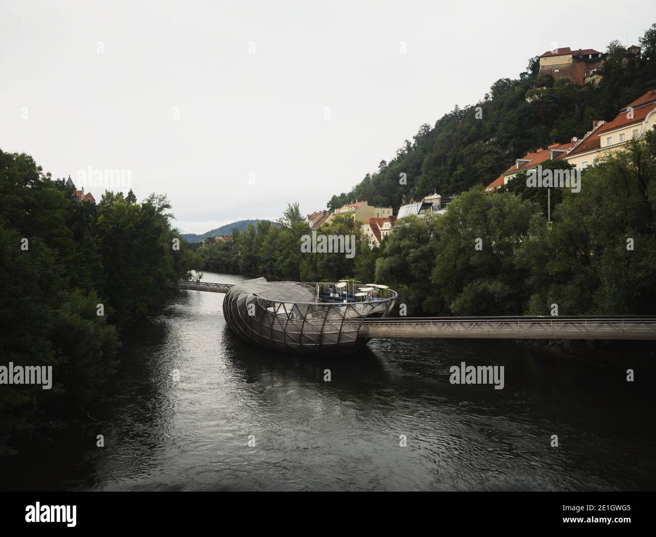Panorama of Murinsel artifical island building cafe amphitheatre sea shell footbridge on Mur river in Graz Styria Austria Europe Stock Photo